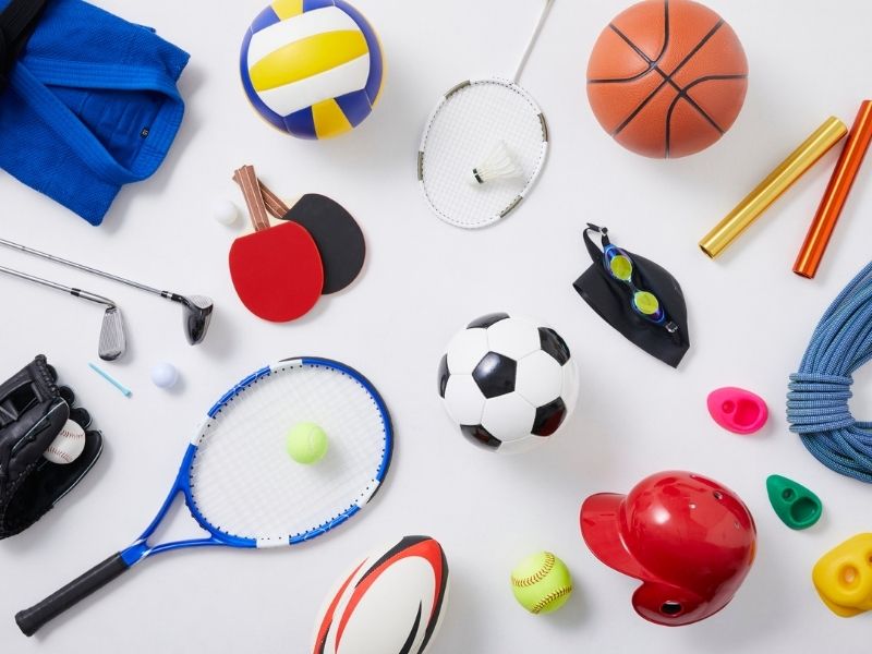 A series of sports kit items including racquets, balls and weights. Symbolising the crcular nature of sport.