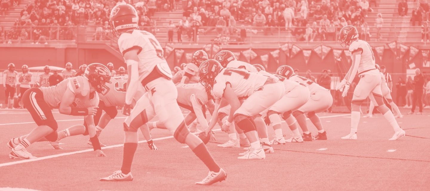 Youth playing American football in full kit from kitround’s circular collection.