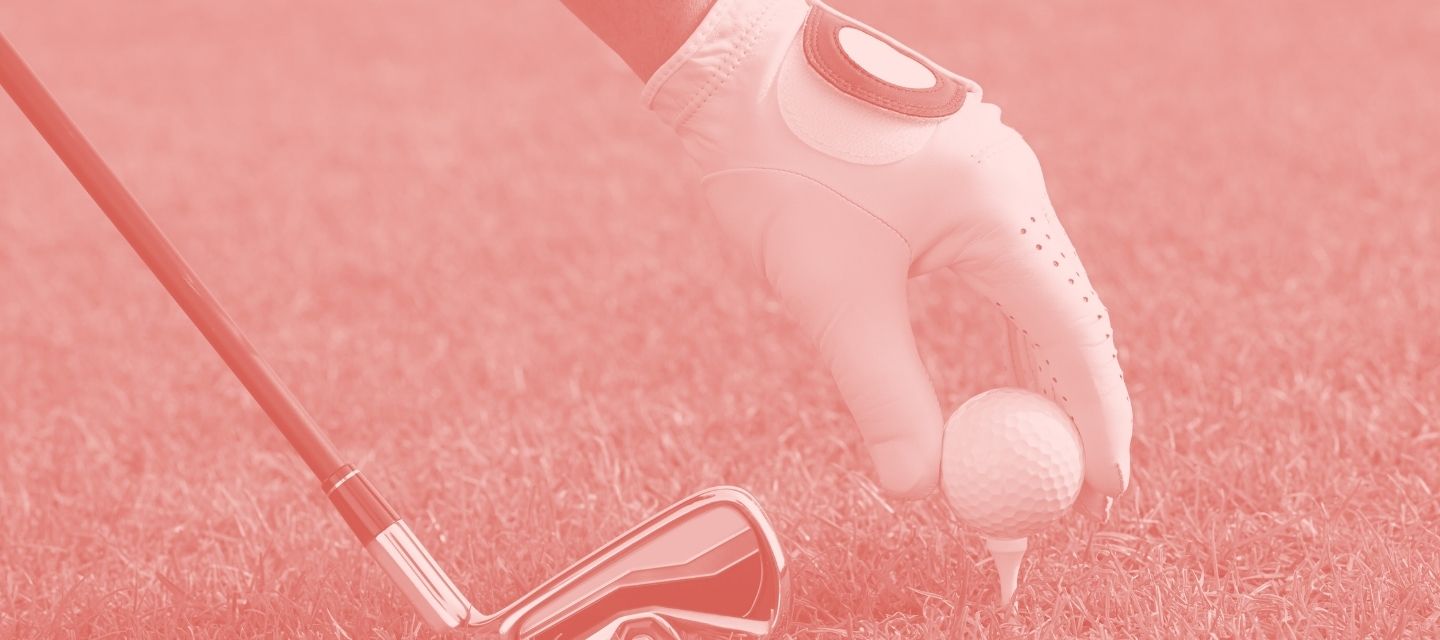 Golfer with club and ball from kitround’s circular golf shop.