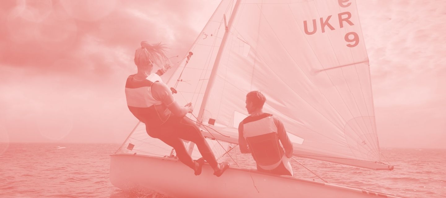 Sailors on water wearing reused gear from kitround’s sailing range.