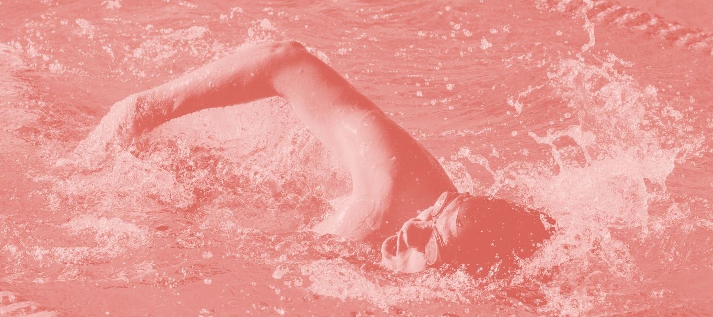 Swimmer in motion with kit from kitround’s swimming collection.