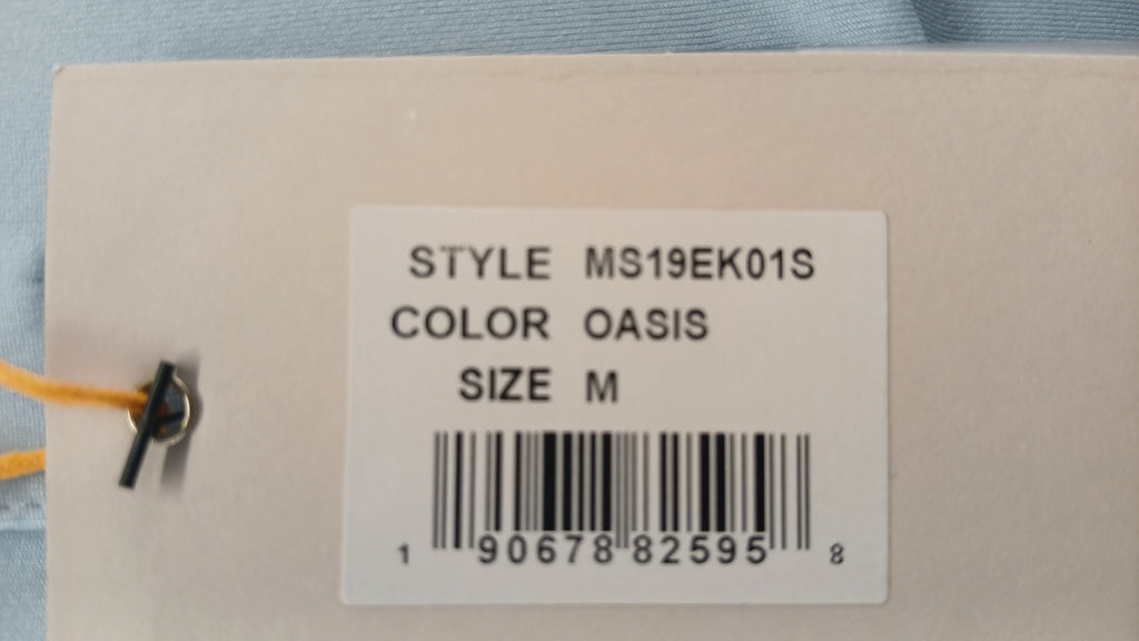 Close-up of the product tag for Peter Millar Icons Series Japan 2019 oasis polo shirt, style MS19EK01S, size M