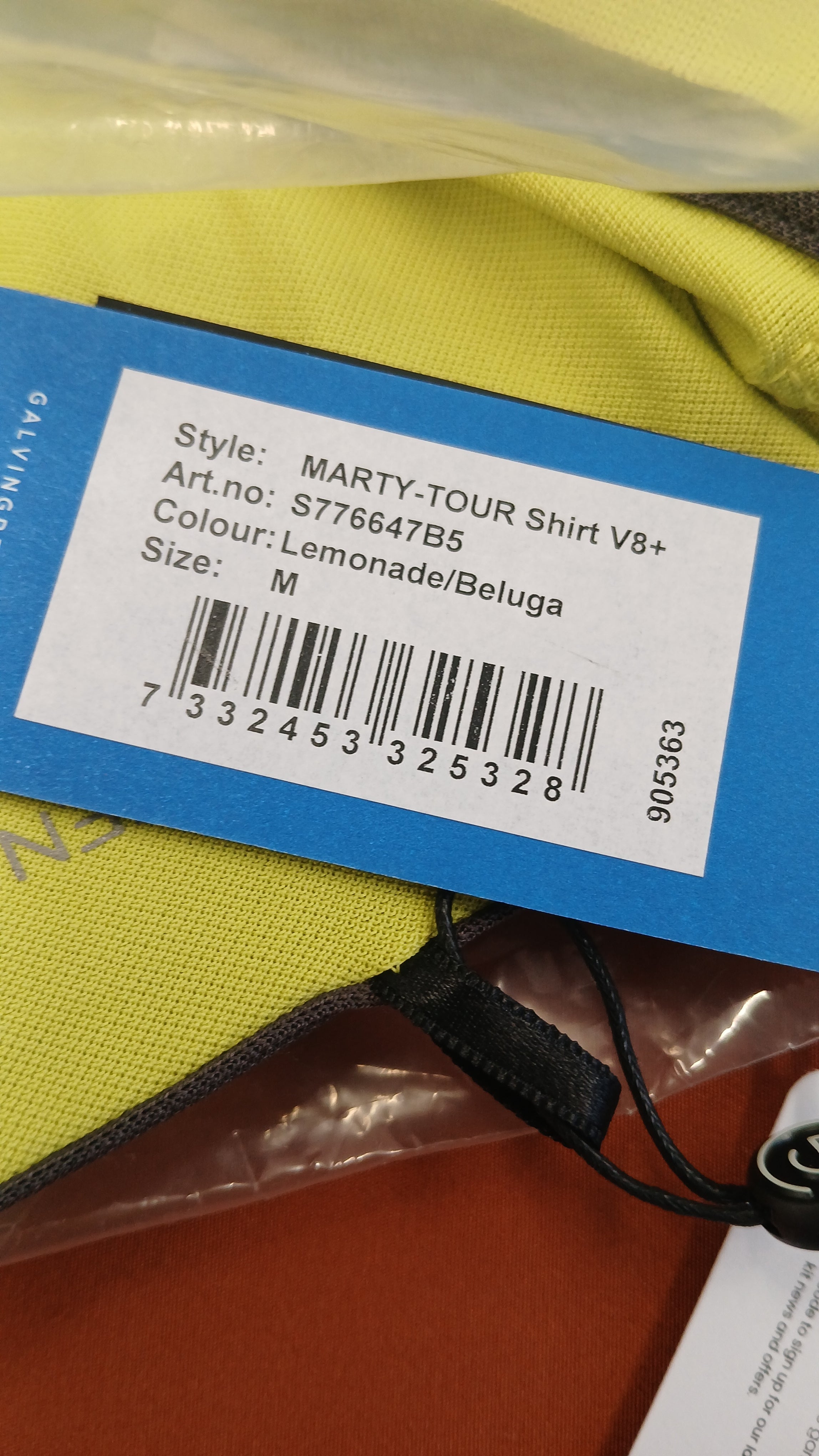 Close-up of product tag showing Galvin Green Icons Series lemonade golf polo shirt details