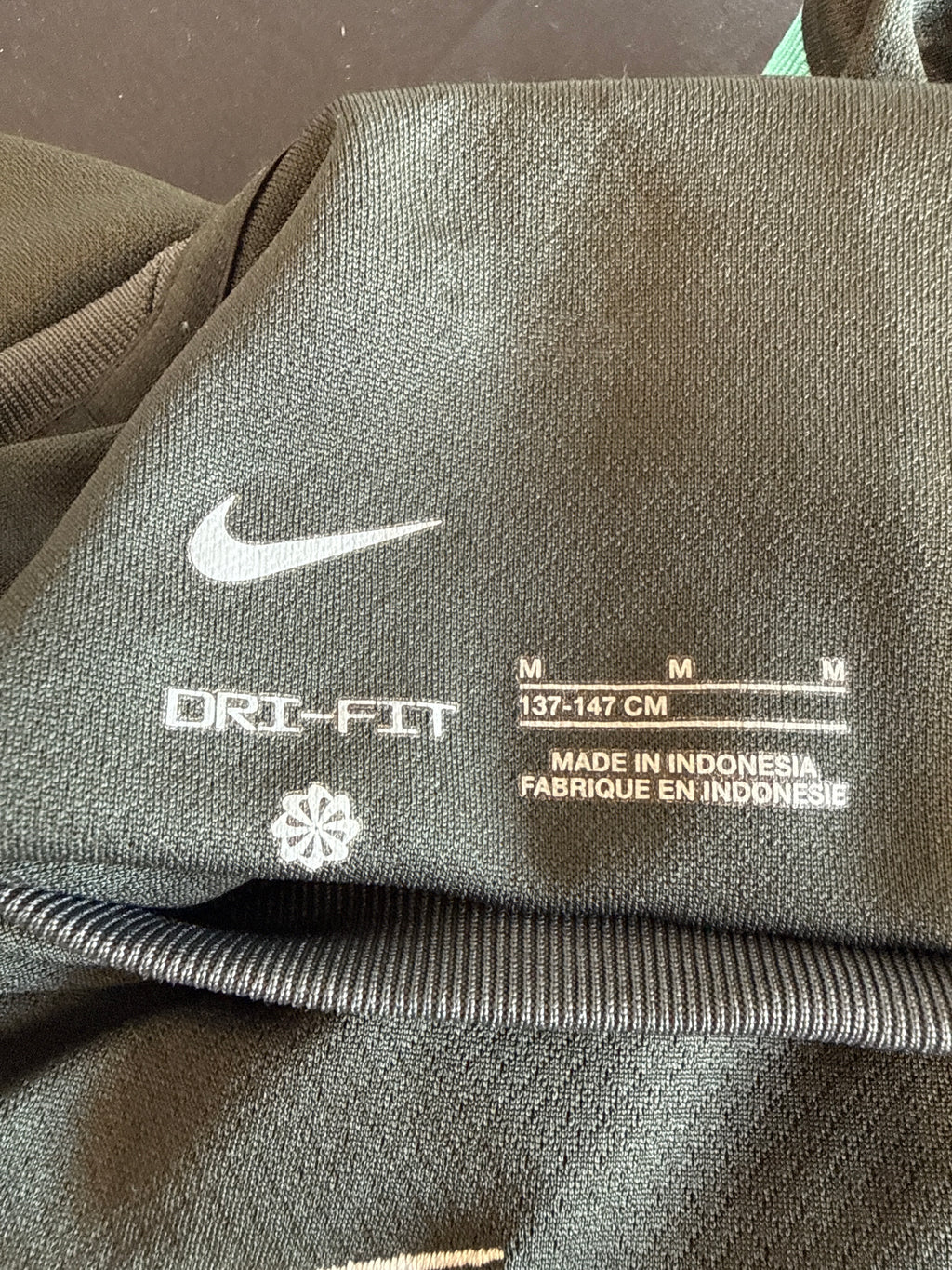 Nike Dri-FIT label with size information inside shirt
