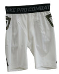 A pair of white Nike Pro Combat shorts for men, featuring a black waistband with repeating grey text, and side mesh panels, is isolated on a pure white background.