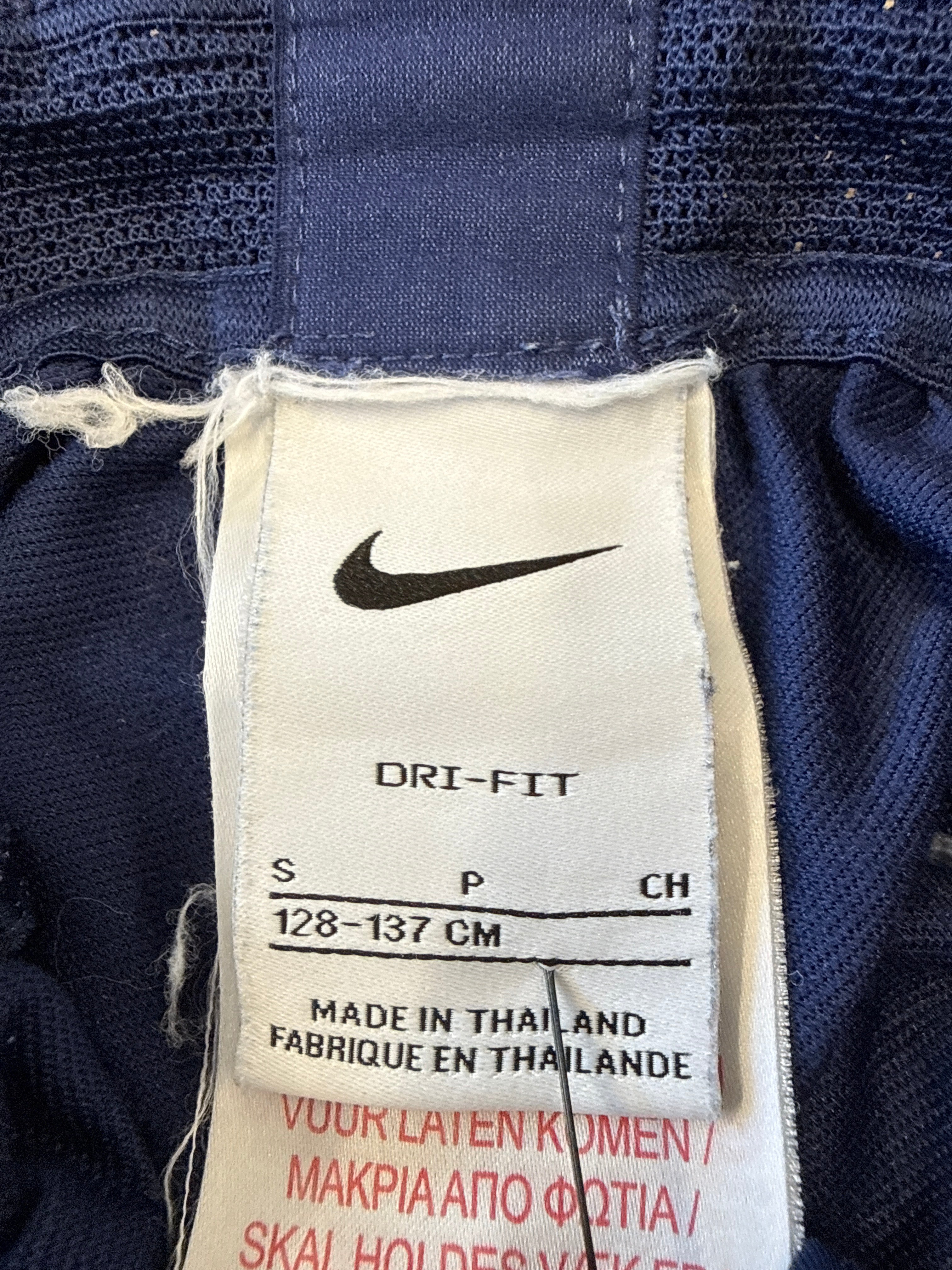 Close-up of Nike Dri-FIT label on Tottenham Hotspur training pants