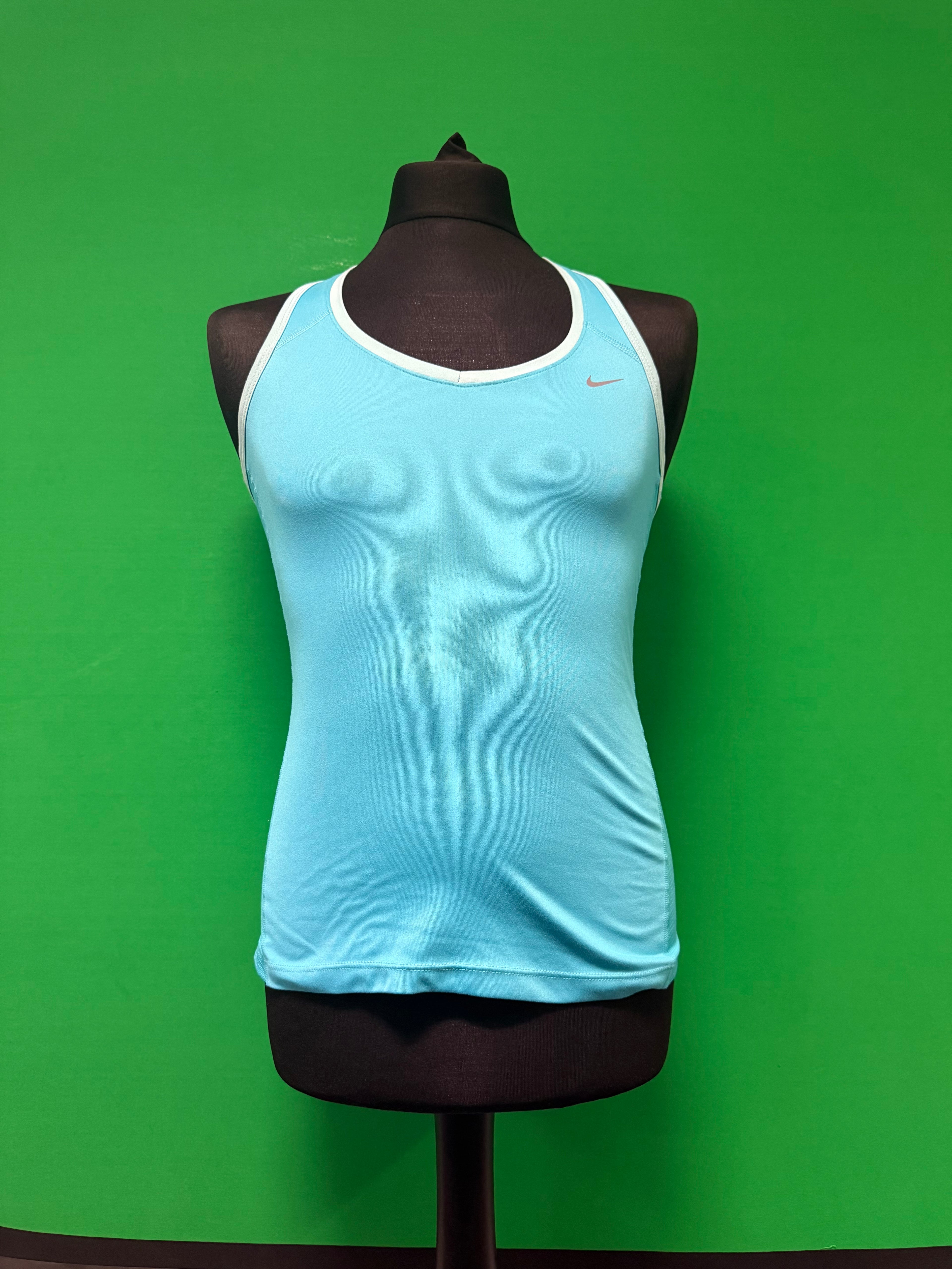 Front view of Nike women's racerback tank top in light blue with white trim displayed on black mannequin