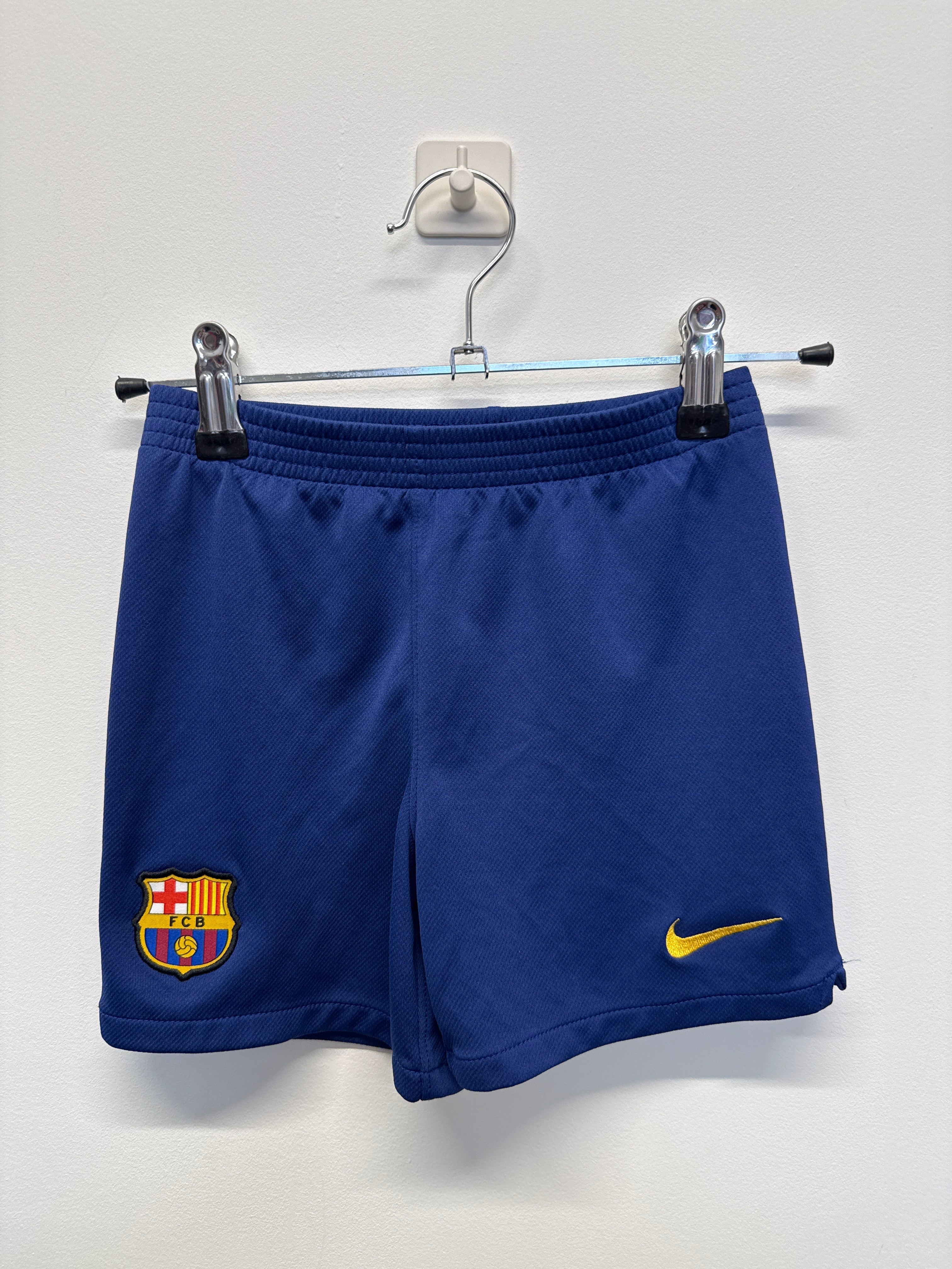 Front view of blue Barcelona kids' football shorts with Nike logo and club crest