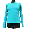 Under Armour long sleeve blue performance t-shirt on black mannequin against green background