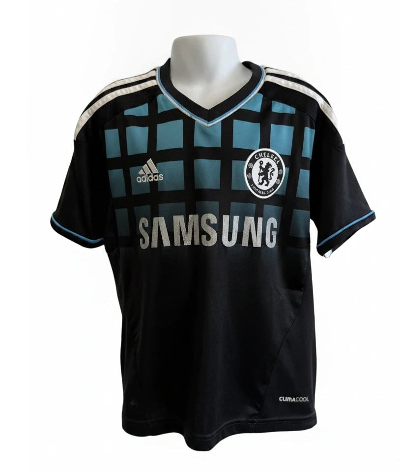 Front view of Chelsea FC kids' black adidas football shirt with teal grid pattern