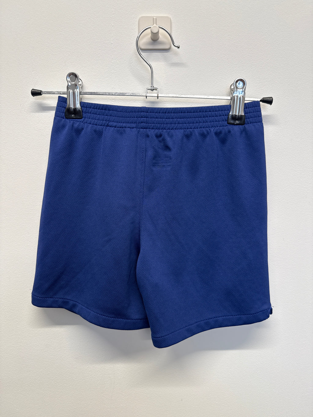 Back view of blue Nike Barcelona kids' football shorts