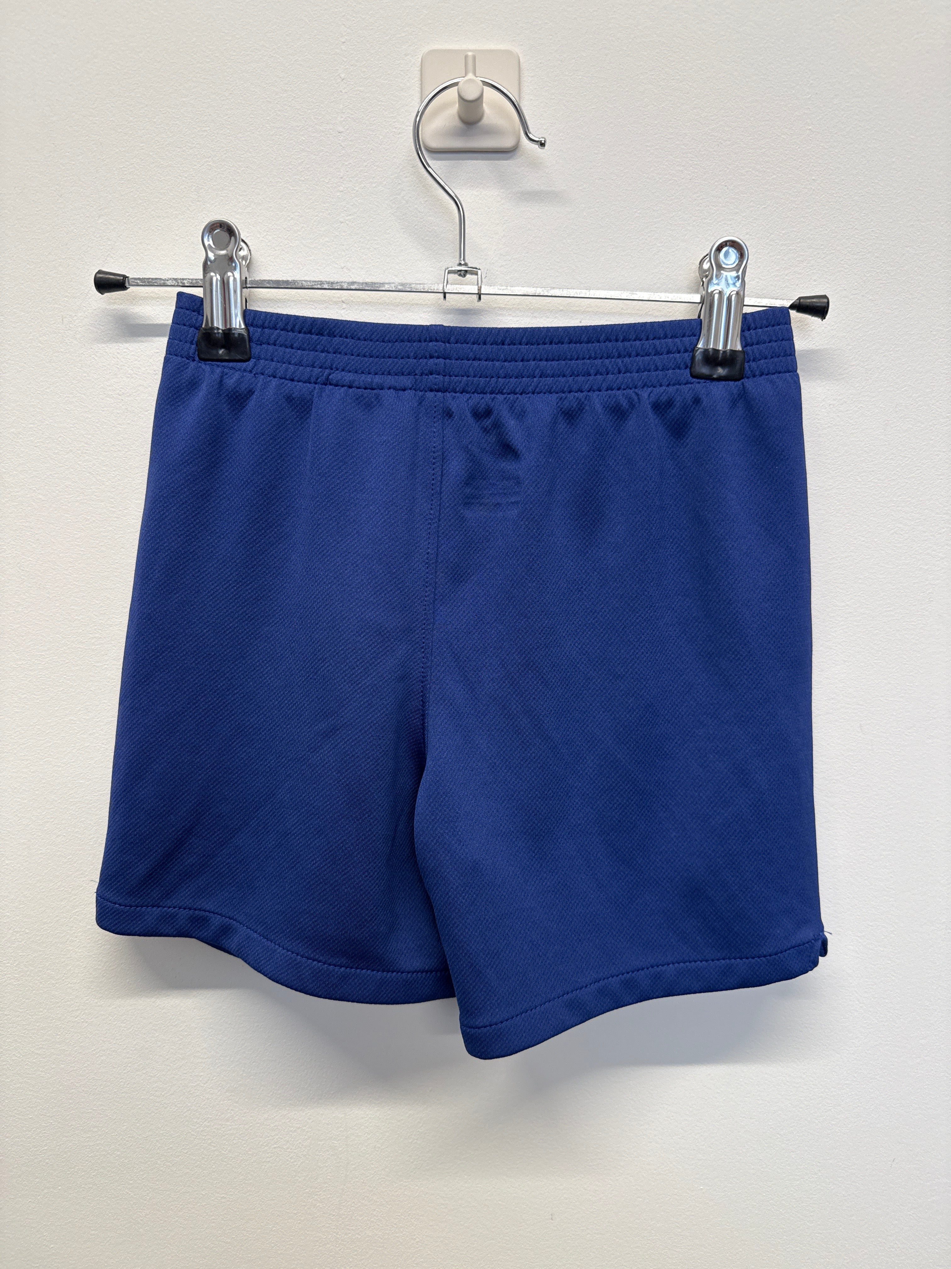 Back view of blue Nike Barcelona kids' football shorts