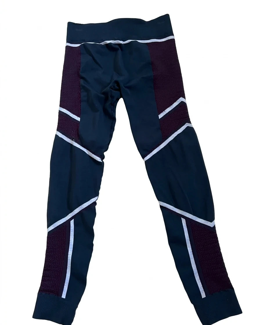 Enhanced Front view of Sweaty Betty multi-coloured patterned leggings in navy, plum and white
