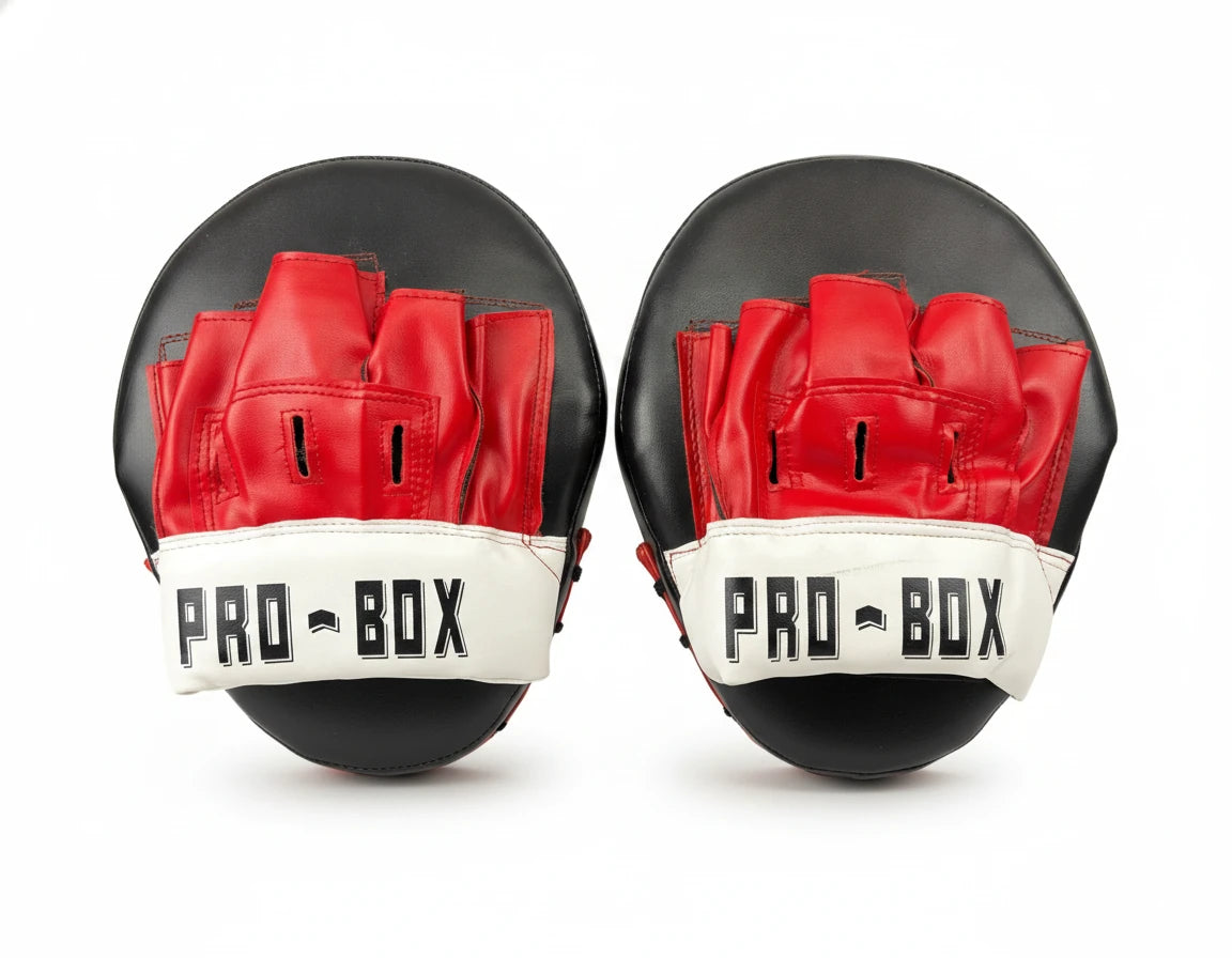 A pair of Pro-Box Curved Sparring Pads in red, black, and white, professionally photographed on a clean white background with studio lighting and soft shadows.