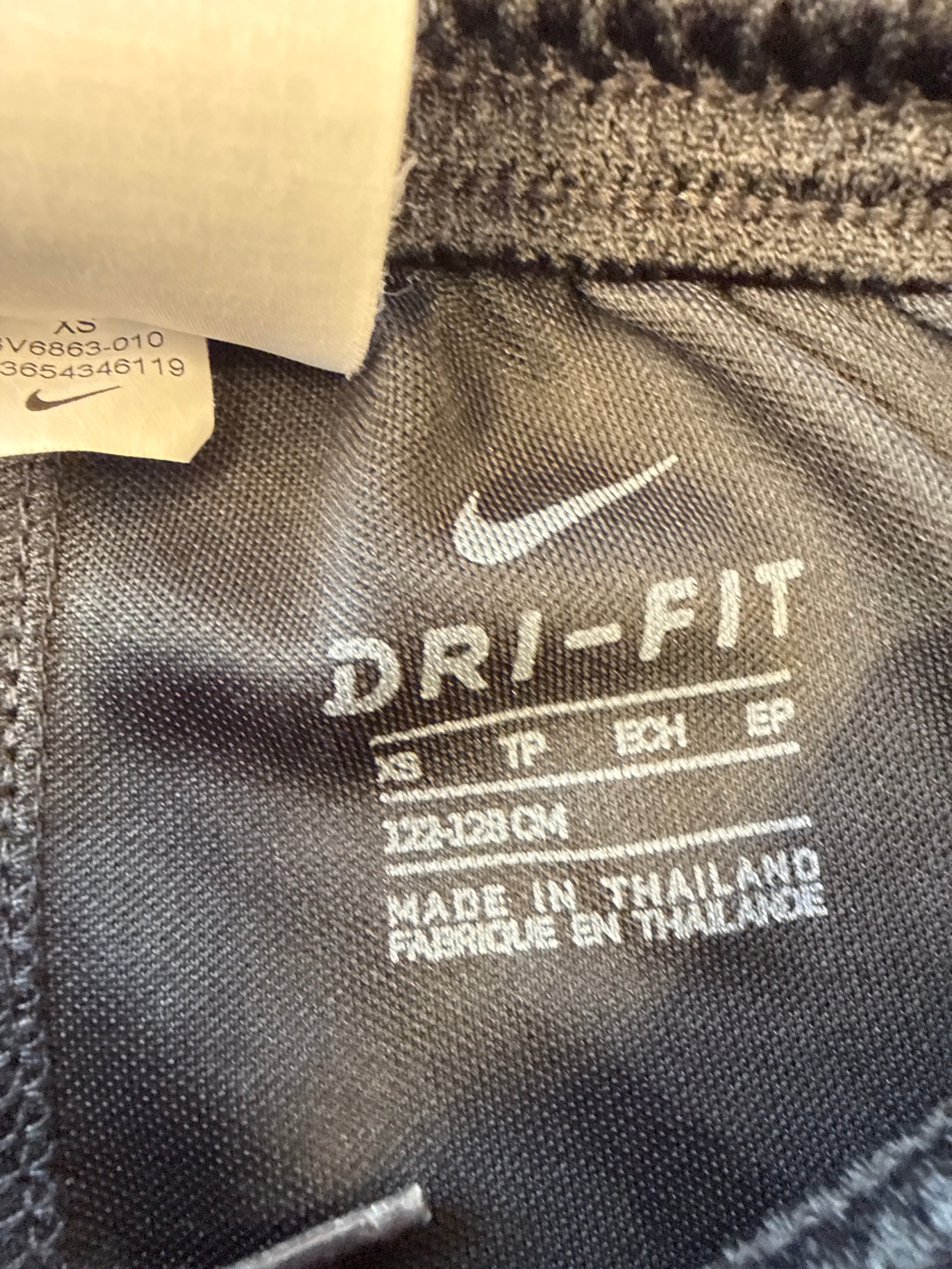 Close-up of Nike Dri-FIT inner label on Sunderland AFC kids' shorts