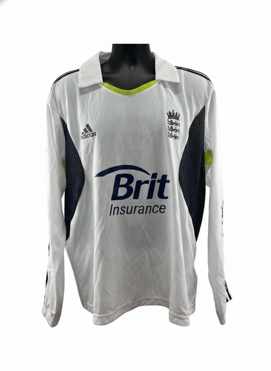 An adidas England Cricket Long Sleeve Jersey in white with black and lime green accents, featuring the Brit Insurance logo and the England cricket crest.