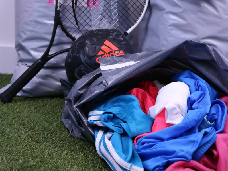 A plastic bag full of sports kit