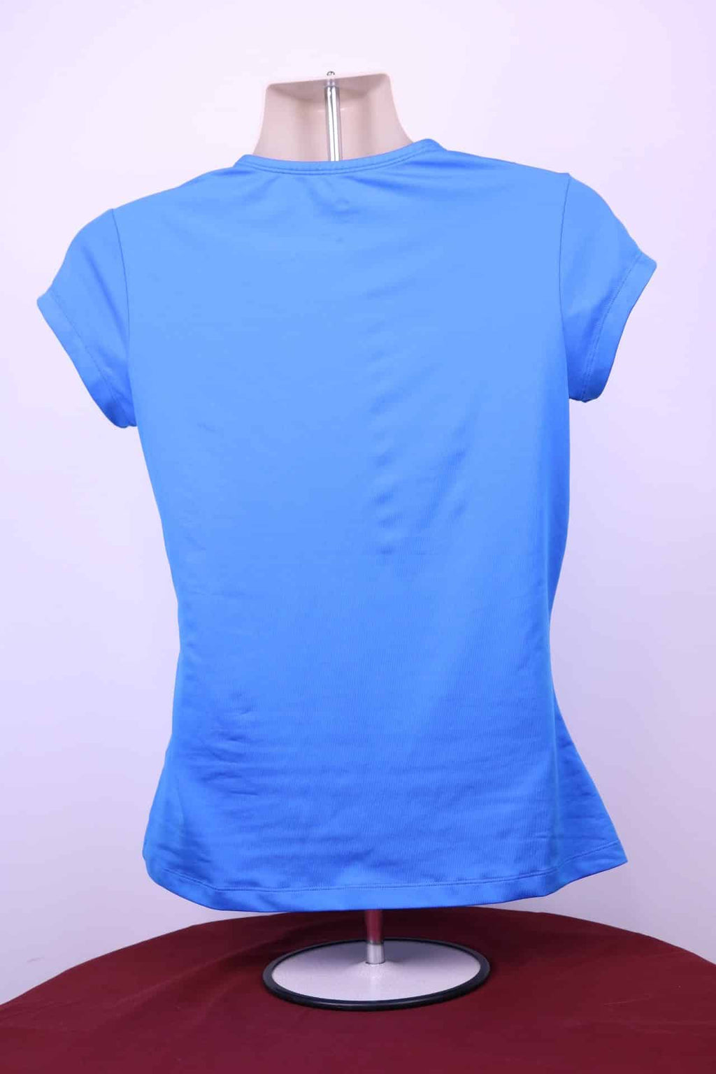 Back view of Nike Women's Dri-Fit blue round neck athletic t-shirt on mannequin