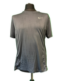 Front view of a grey Nike men’s performance sports t-shirt on a mannequin against a green background