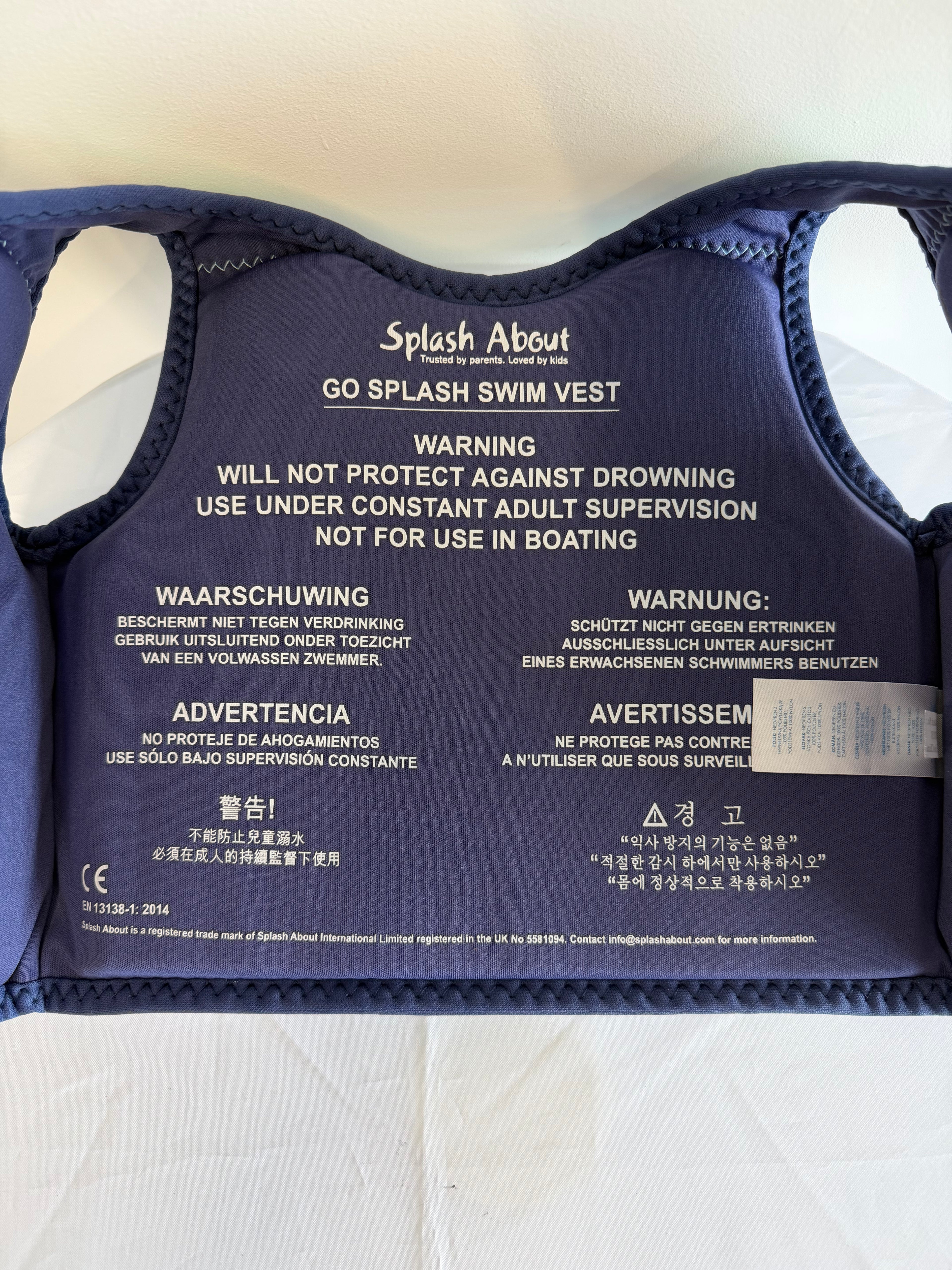 Interior label of Splash About swim vest with usage warning and brand details