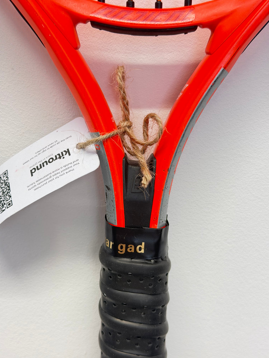 Head Junior tennis racket handle and throat with label attached