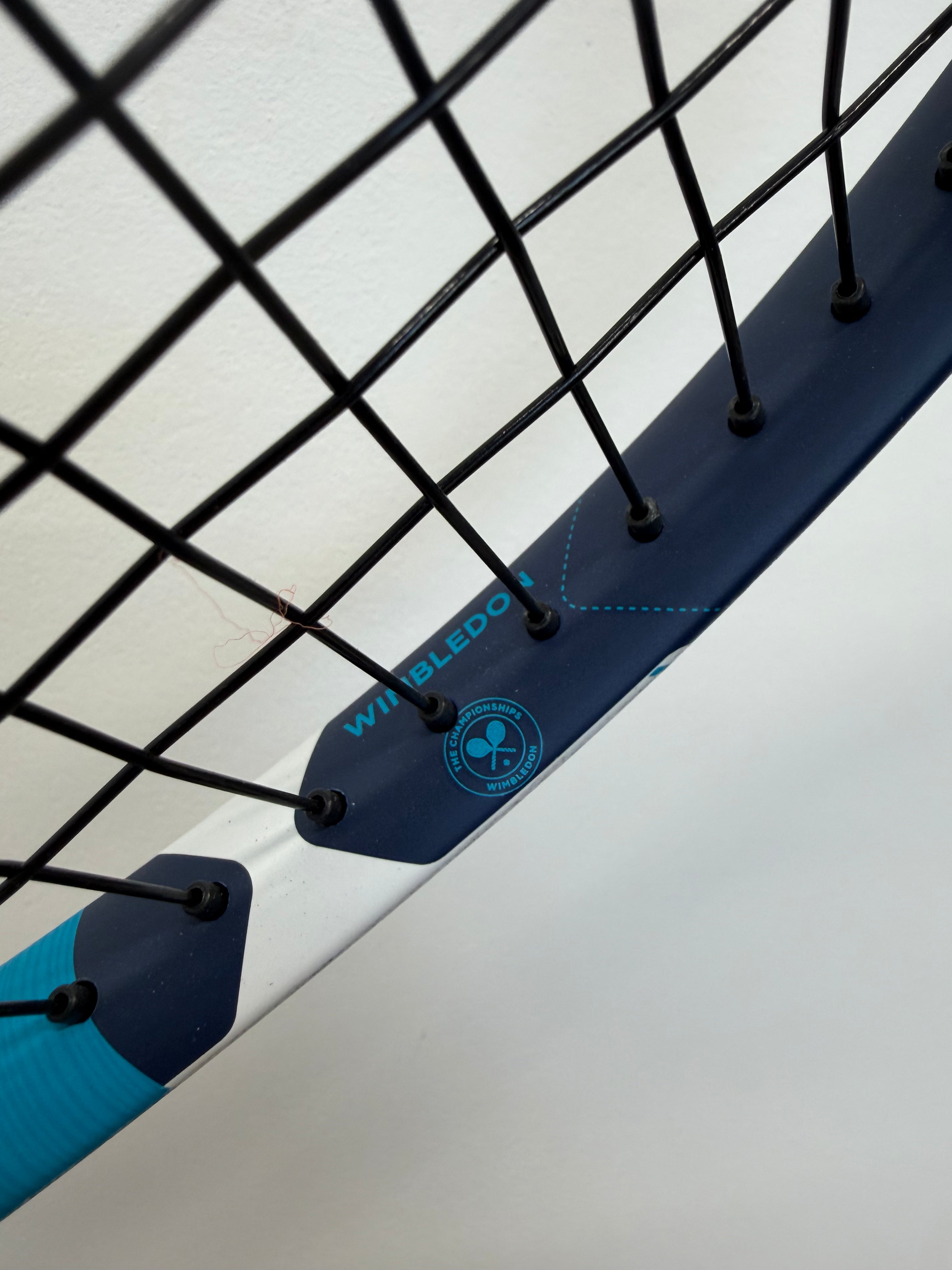 Wimbledon logo detail on Babolat tennis racket inner frame