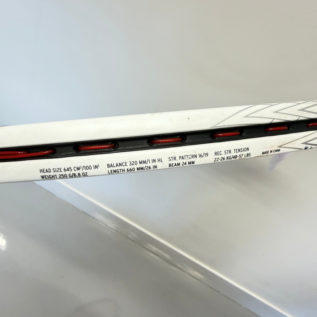 Close-up of Head Speed Junior Tennis Racket frame with specifications