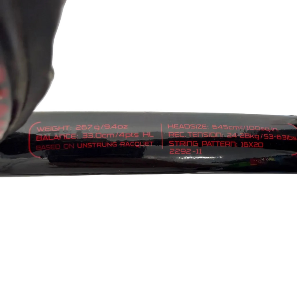 Closeup of Wilson tennis racket specifications details on black shaft
