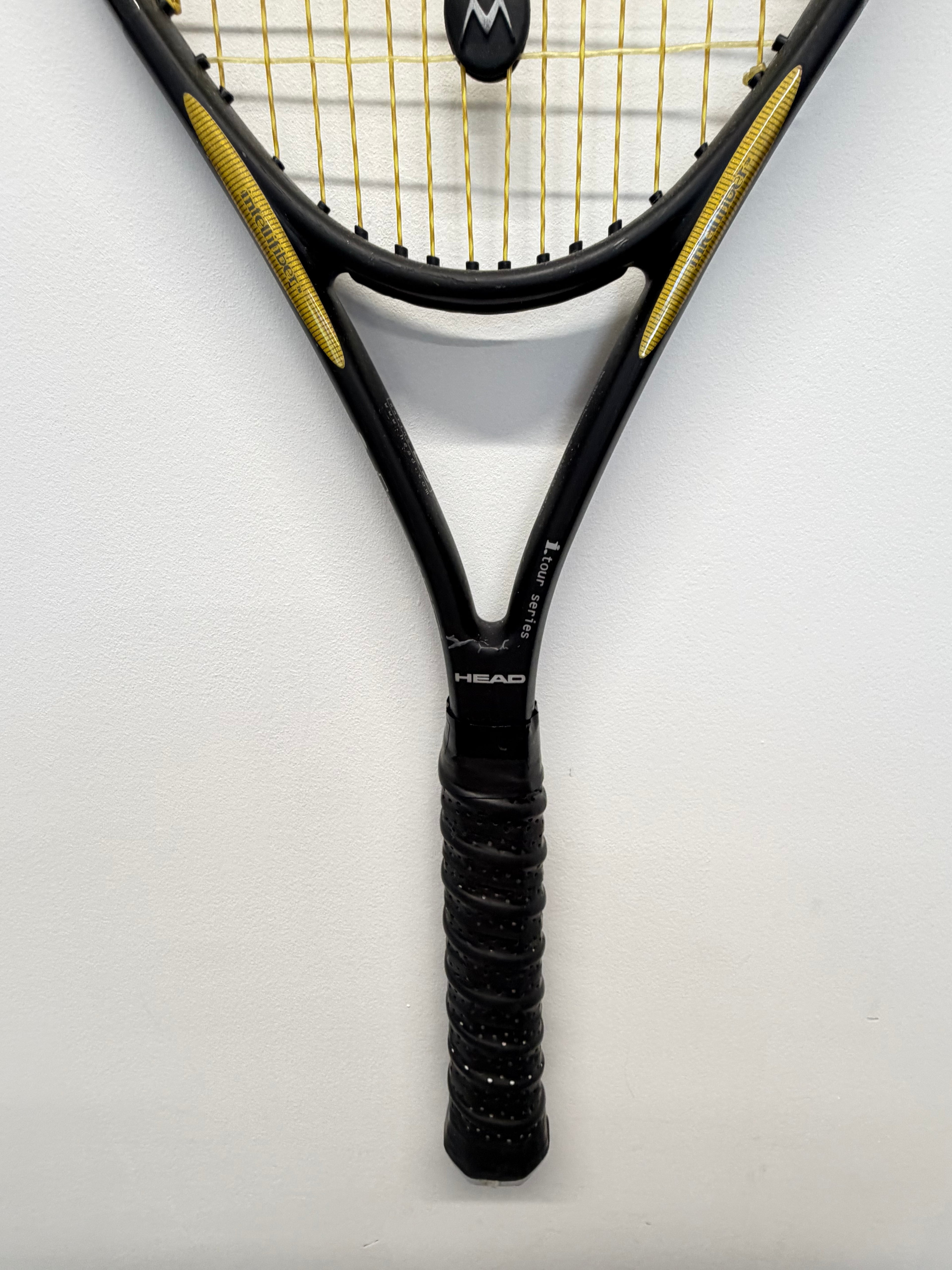 Vertical shot of Head i.Tour tennis racket handle and throat