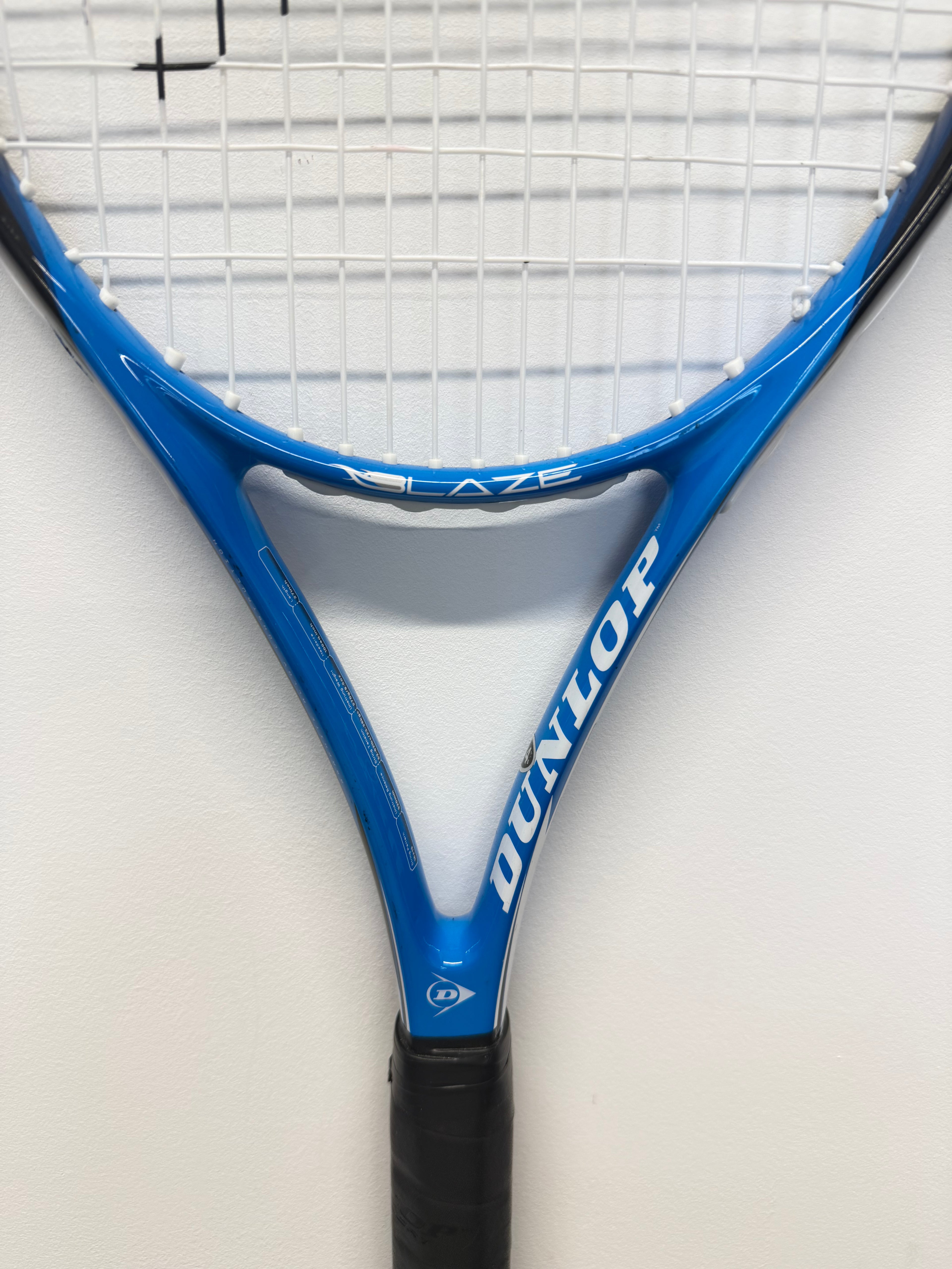 Dunlop Blaze C-100 tennis racket head with white strings and blue frame