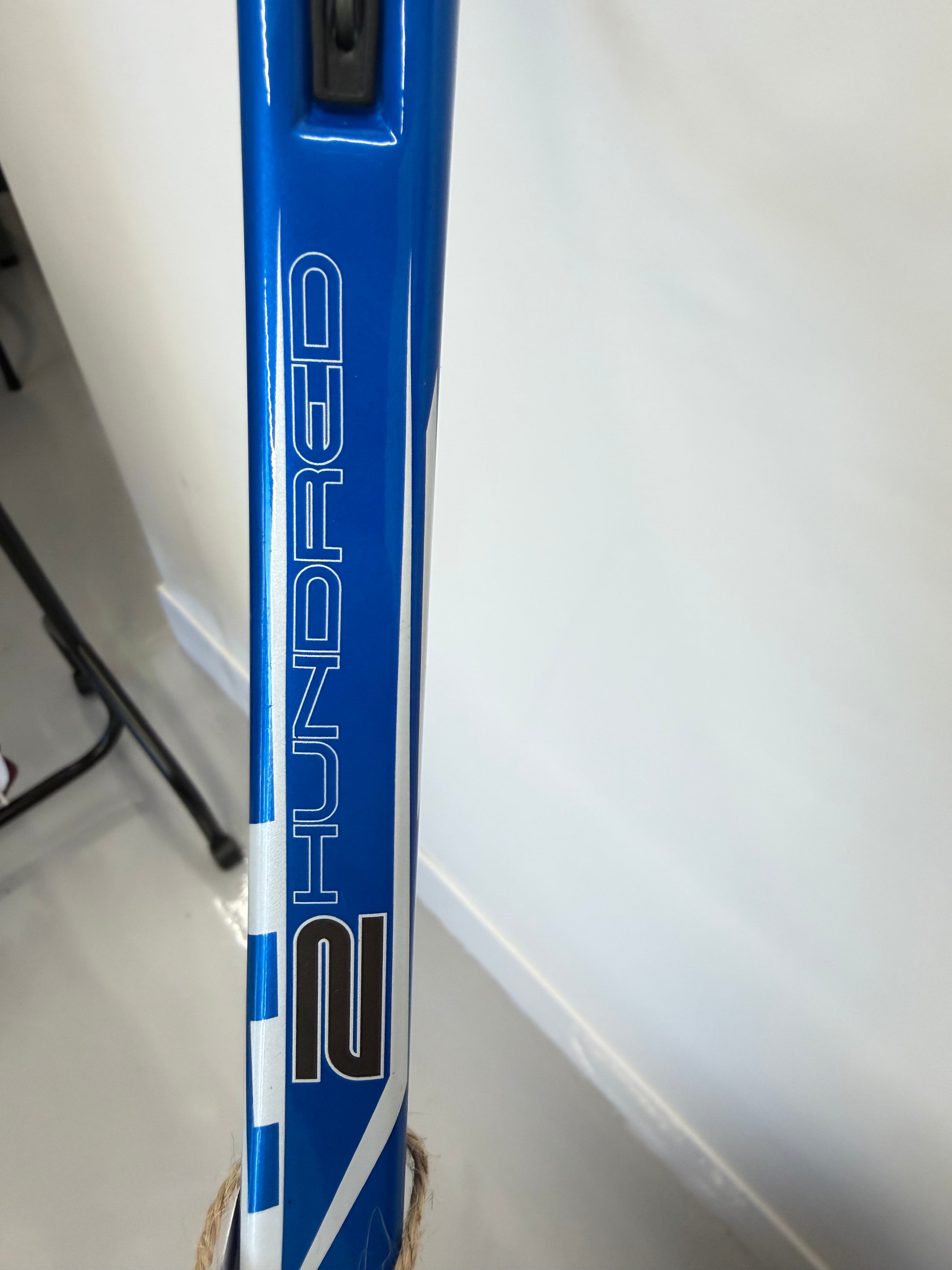 Close-up of 2 Hundred branding on racket frame