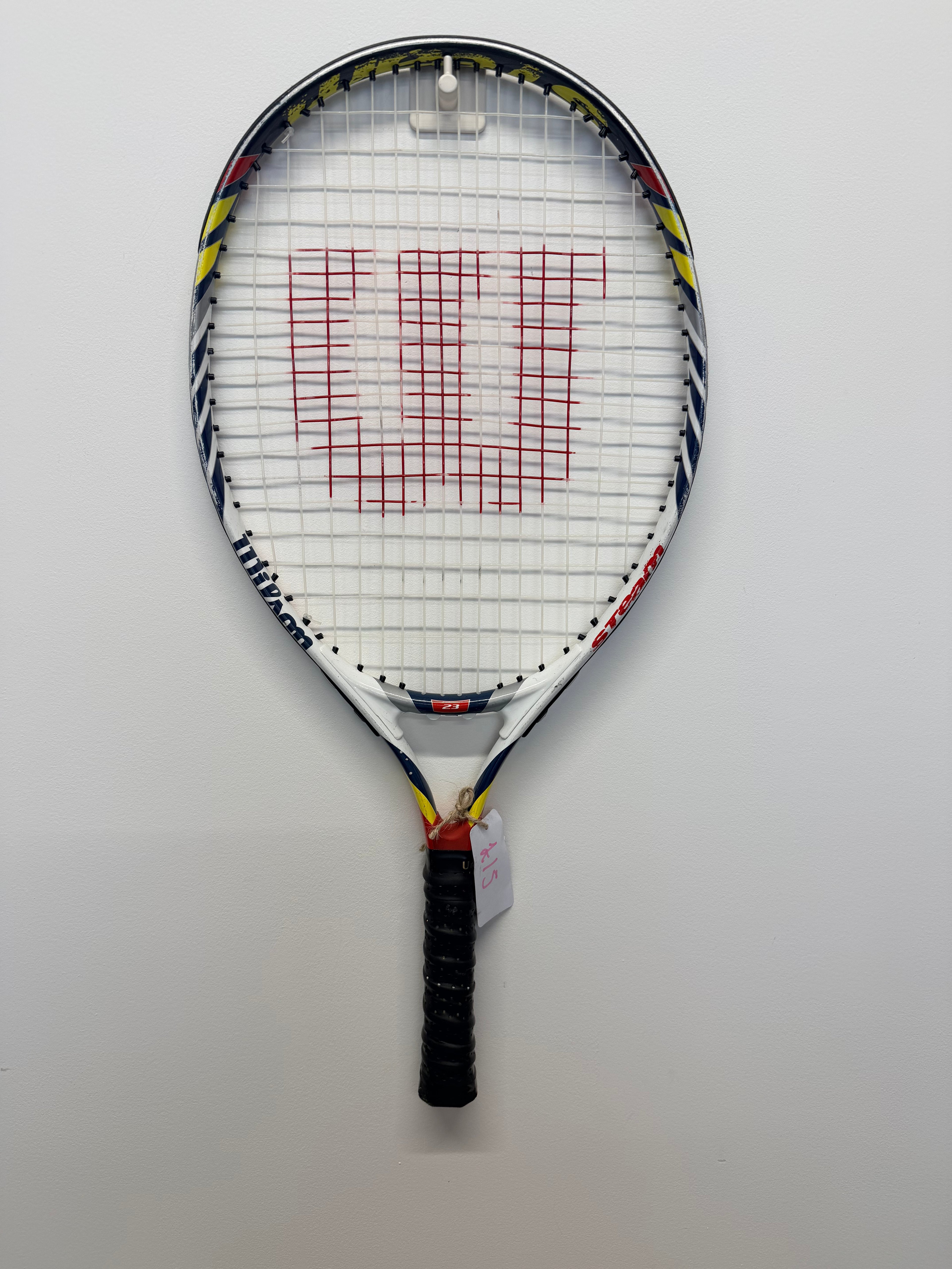 Front view of Wilson Steam tennis racket with red Wilson logo on the strings, multi-colour frame, and black grip