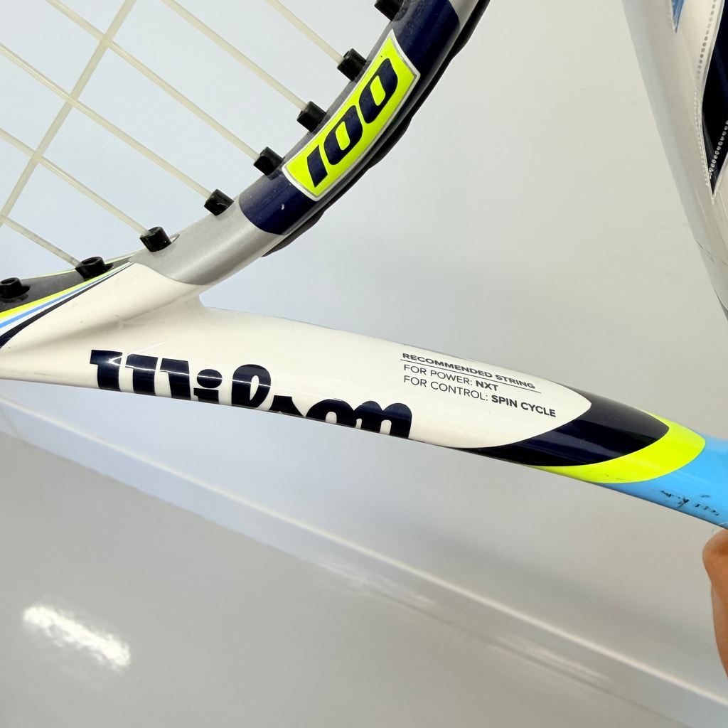 Wilson BLX tennis racket with 100 sq in marking and segment of string bed
