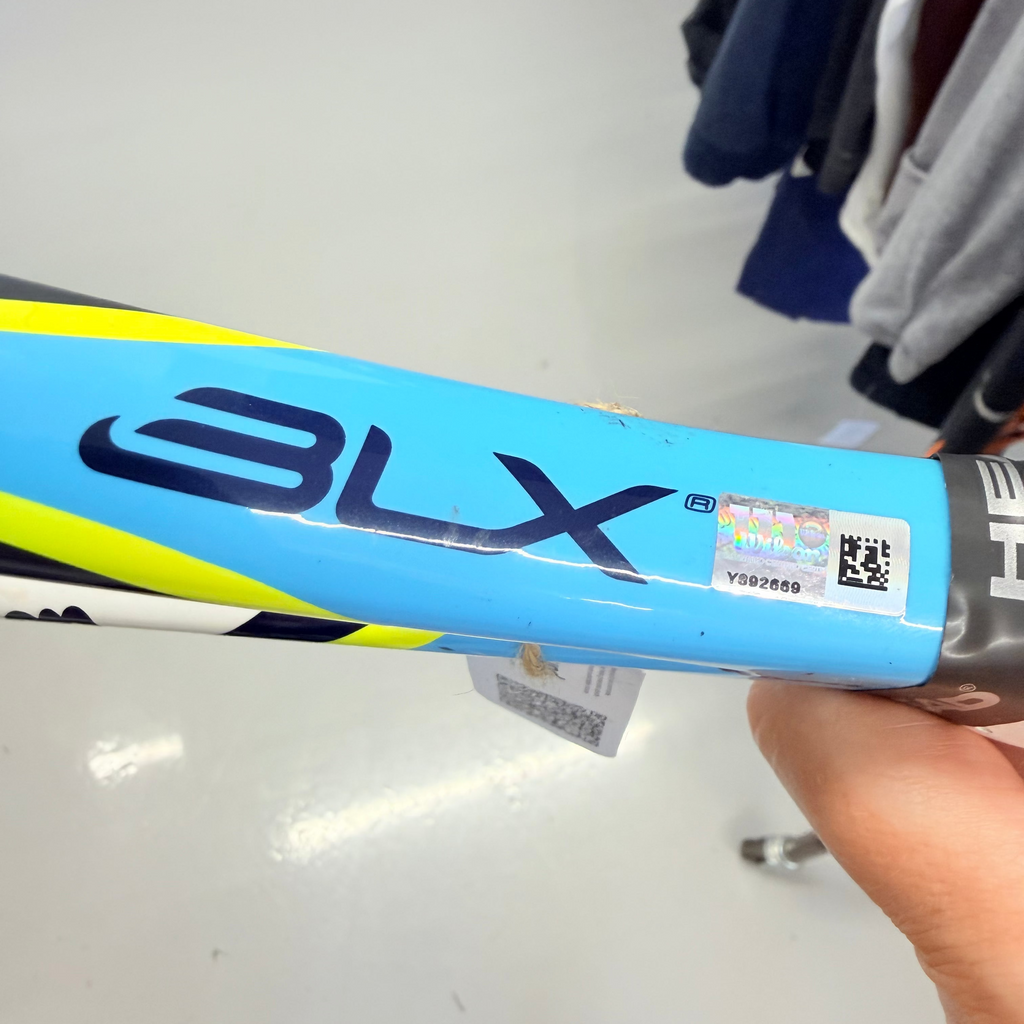 Close-up of Wilson BLX tennis racket shaft showing blue colour and logo