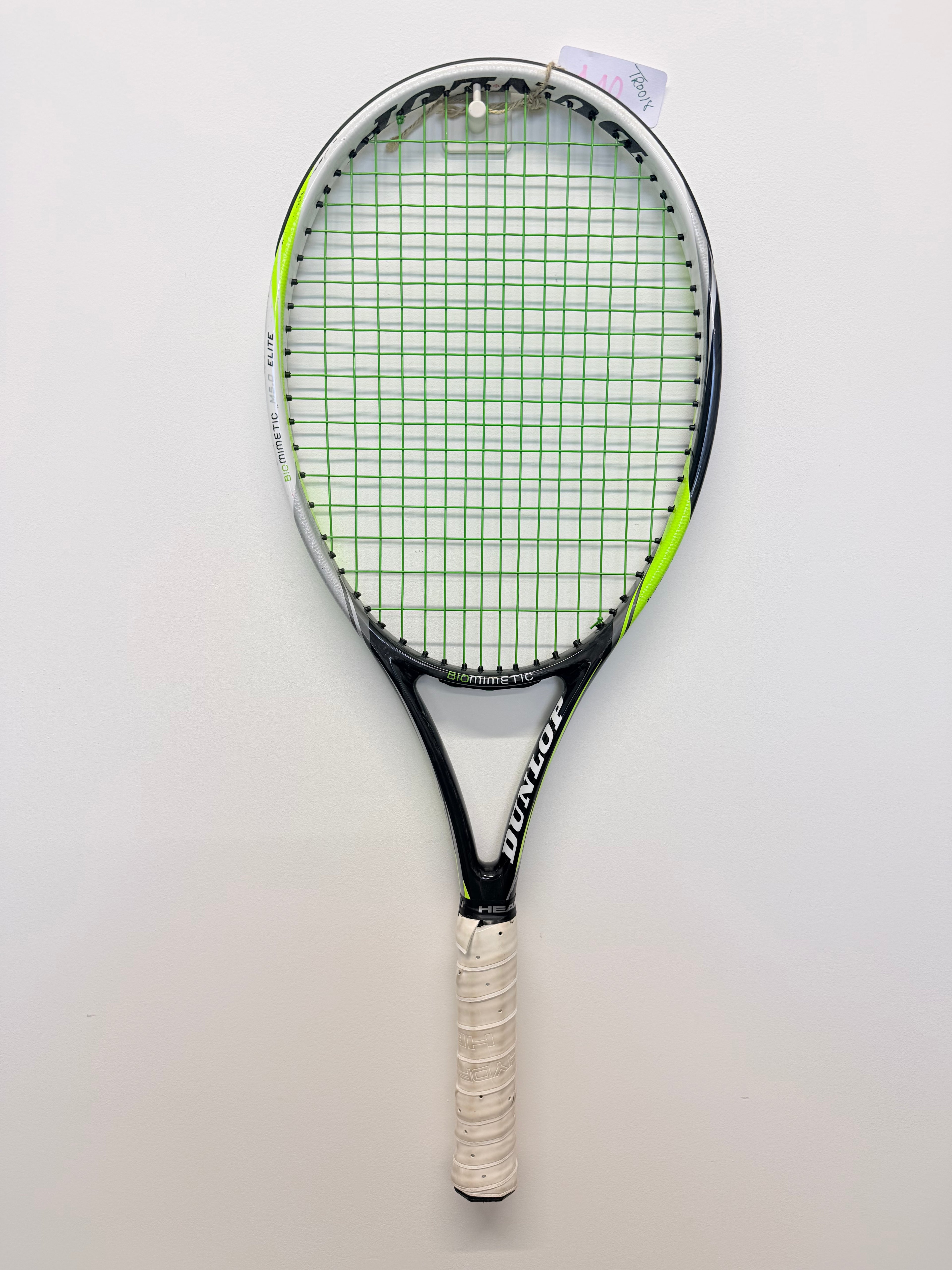 Dunlop Biomimetic M5.0 Elite tennis racket front view against white wall