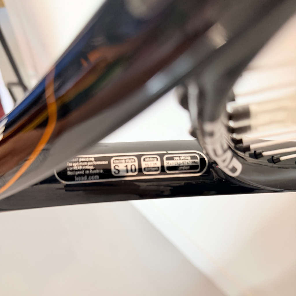 Close-up of Head tennis racket with size and string information