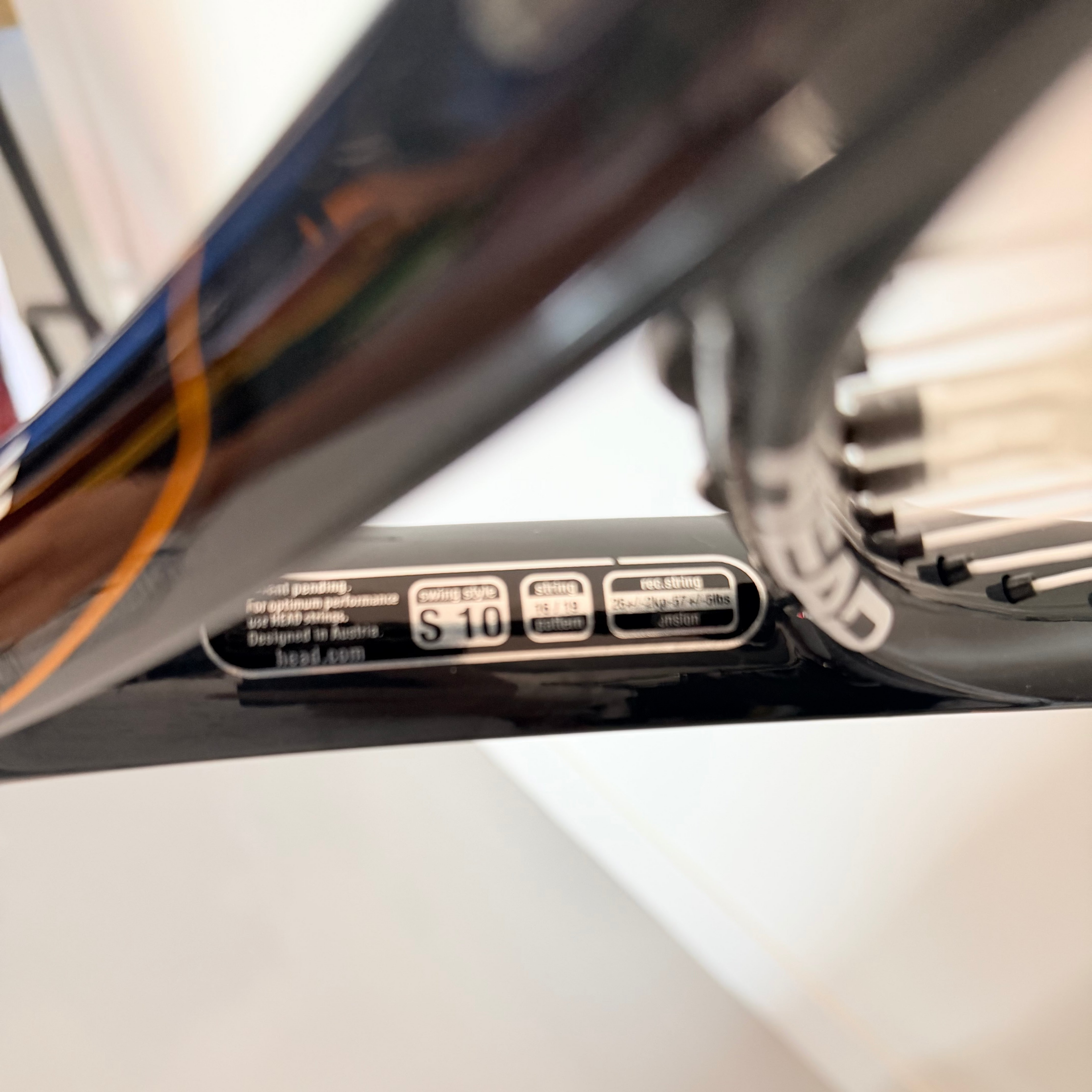 Close-up of Head tennis racket with size and string information