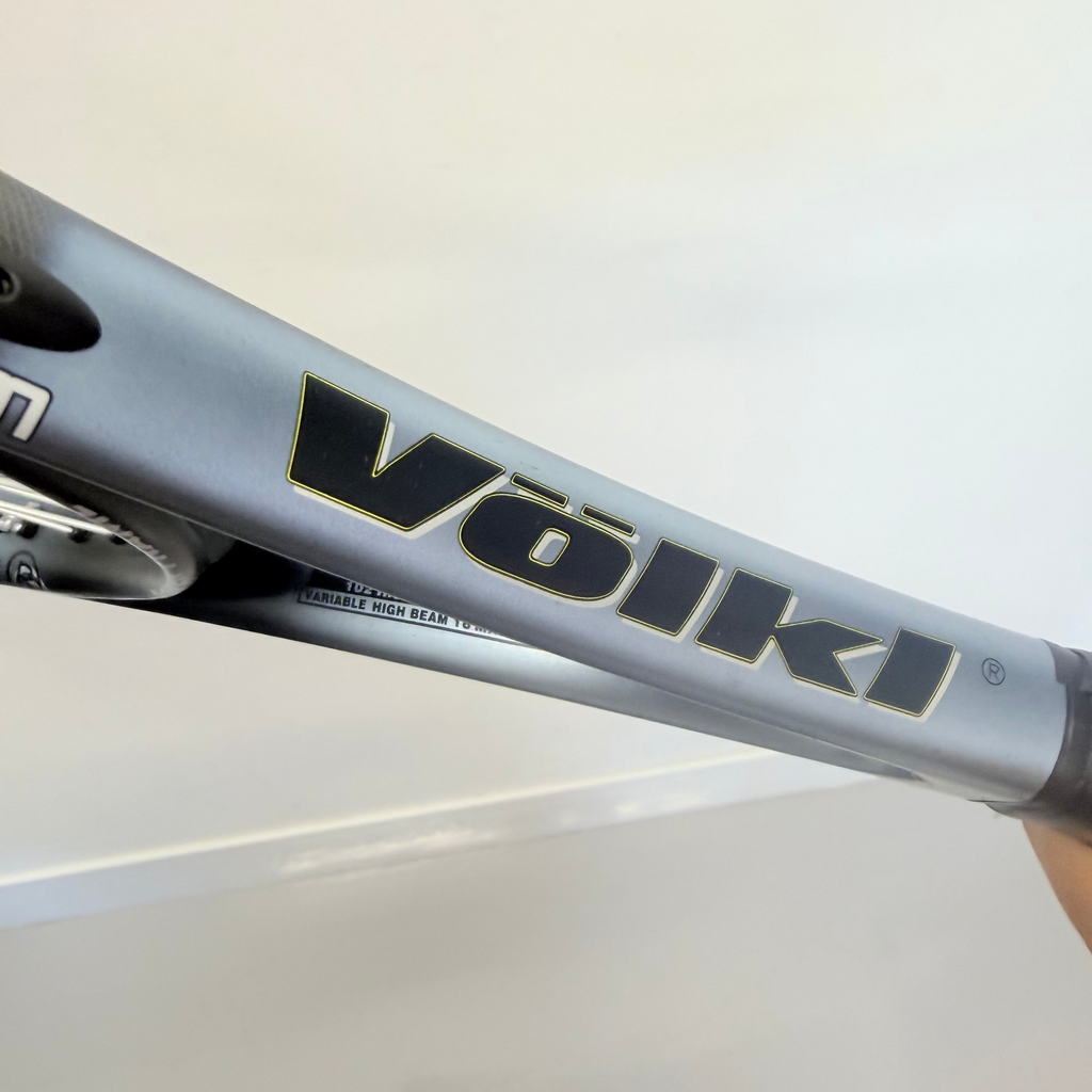Side profile showing Völkl branding on silver tennis racket frame