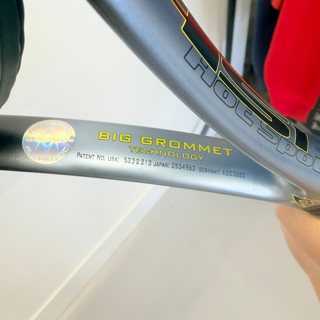 Close-up of Völkl tennis racket Big Grommet technology and authenticity sticker