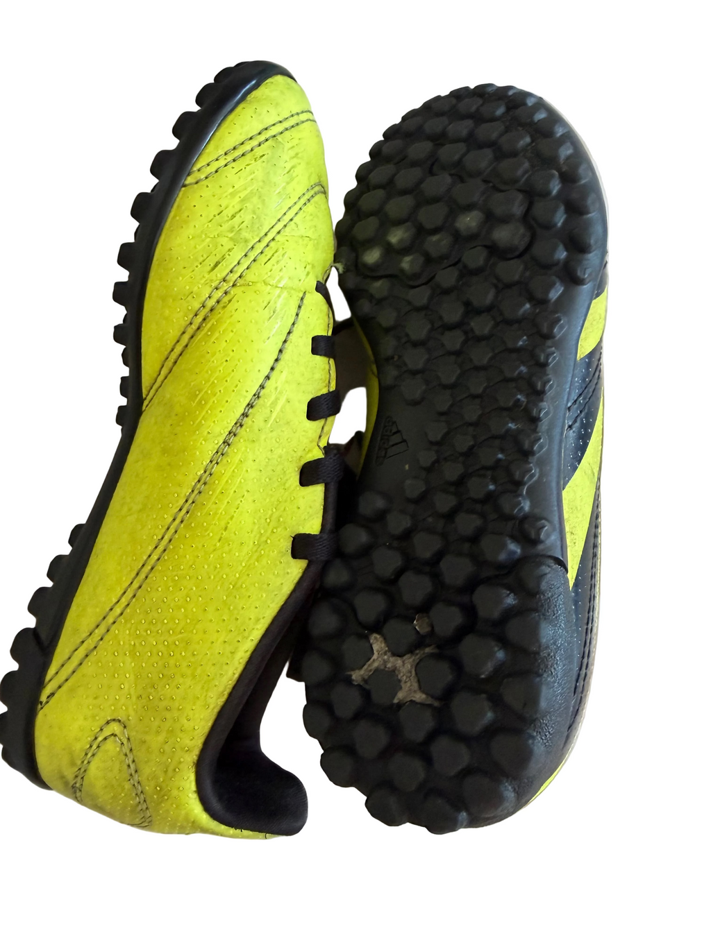 Sole of adidas Predator football boot with textured grip and side view