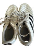 Pair of adidas white football boots with black stripes, top view