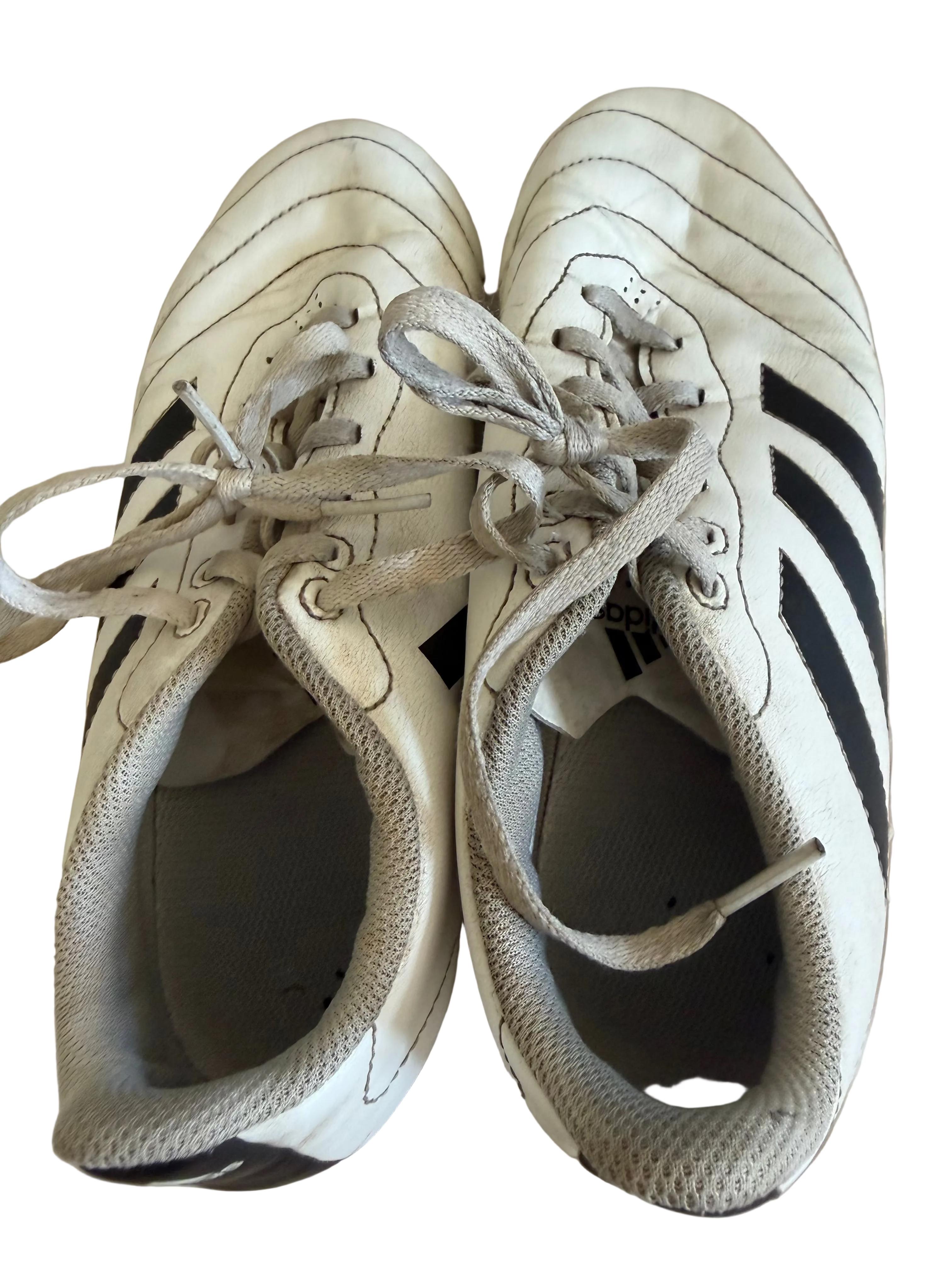 Pair of adidas white football boots with black stripes, top view
