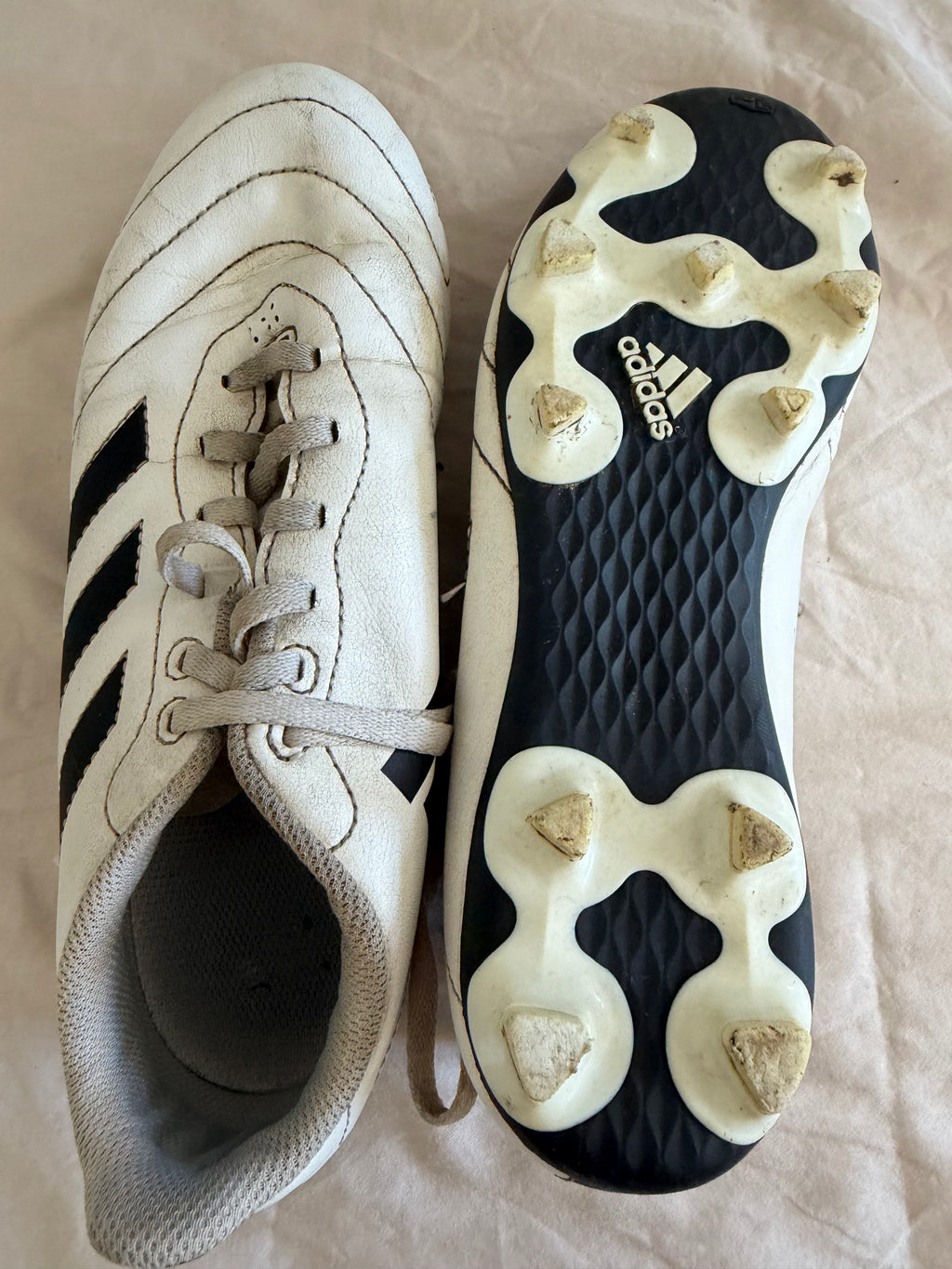 Studded sole of adidas football boots, showing grip and clean design