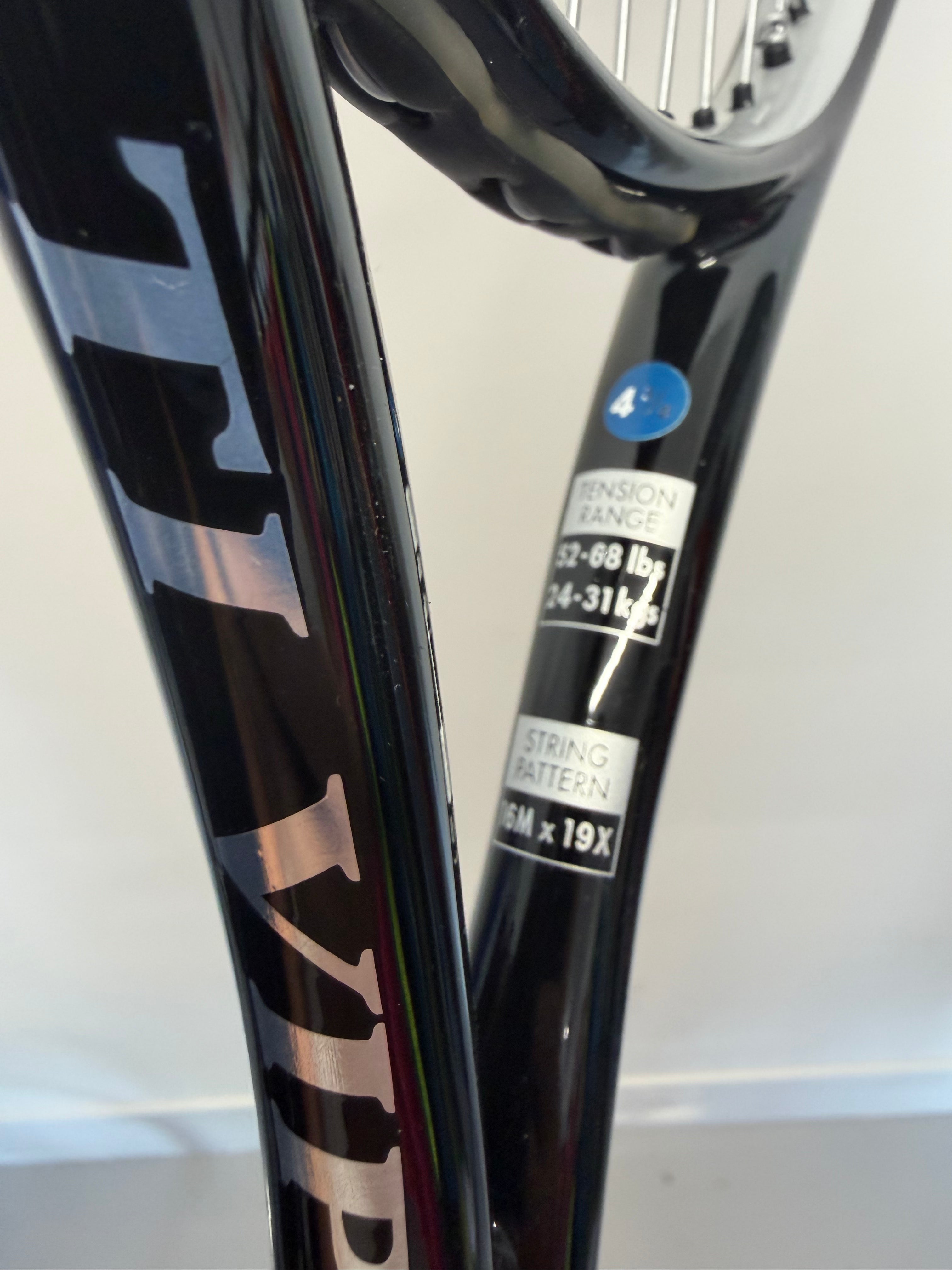 Side view of racket showing TI Viper logo, tension range, and string pattern