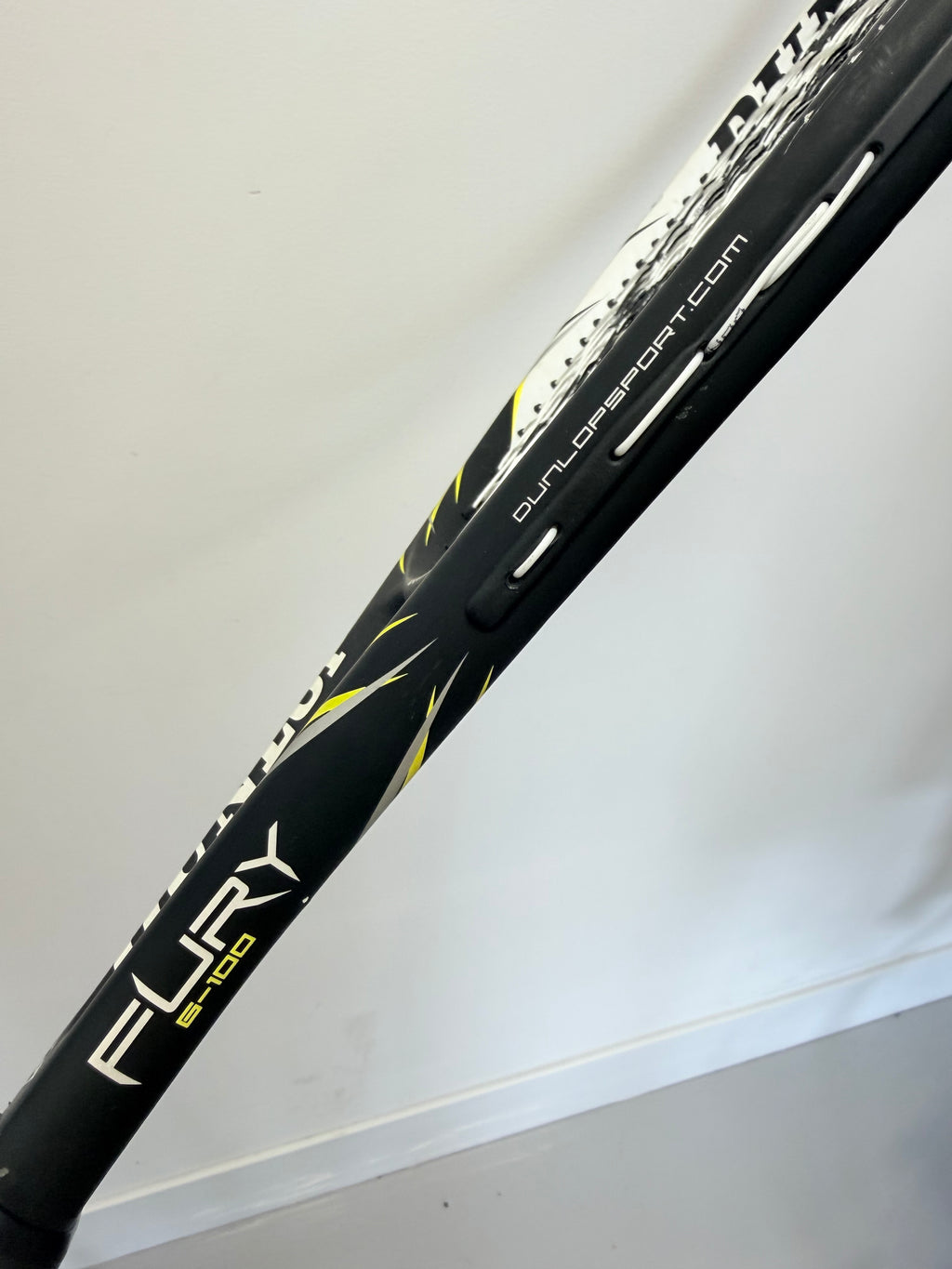 Angled side view of Dunlop Fury G100 with branding and website