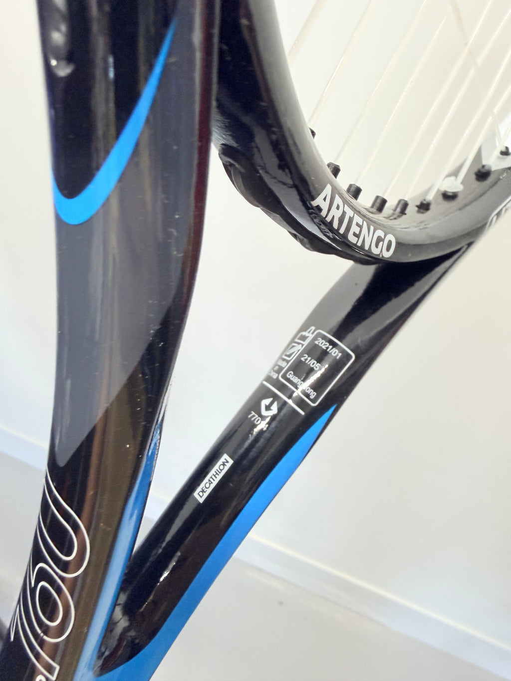 Angled shot of Artengo TR160 Lite tennis racket showing Decathlon branding