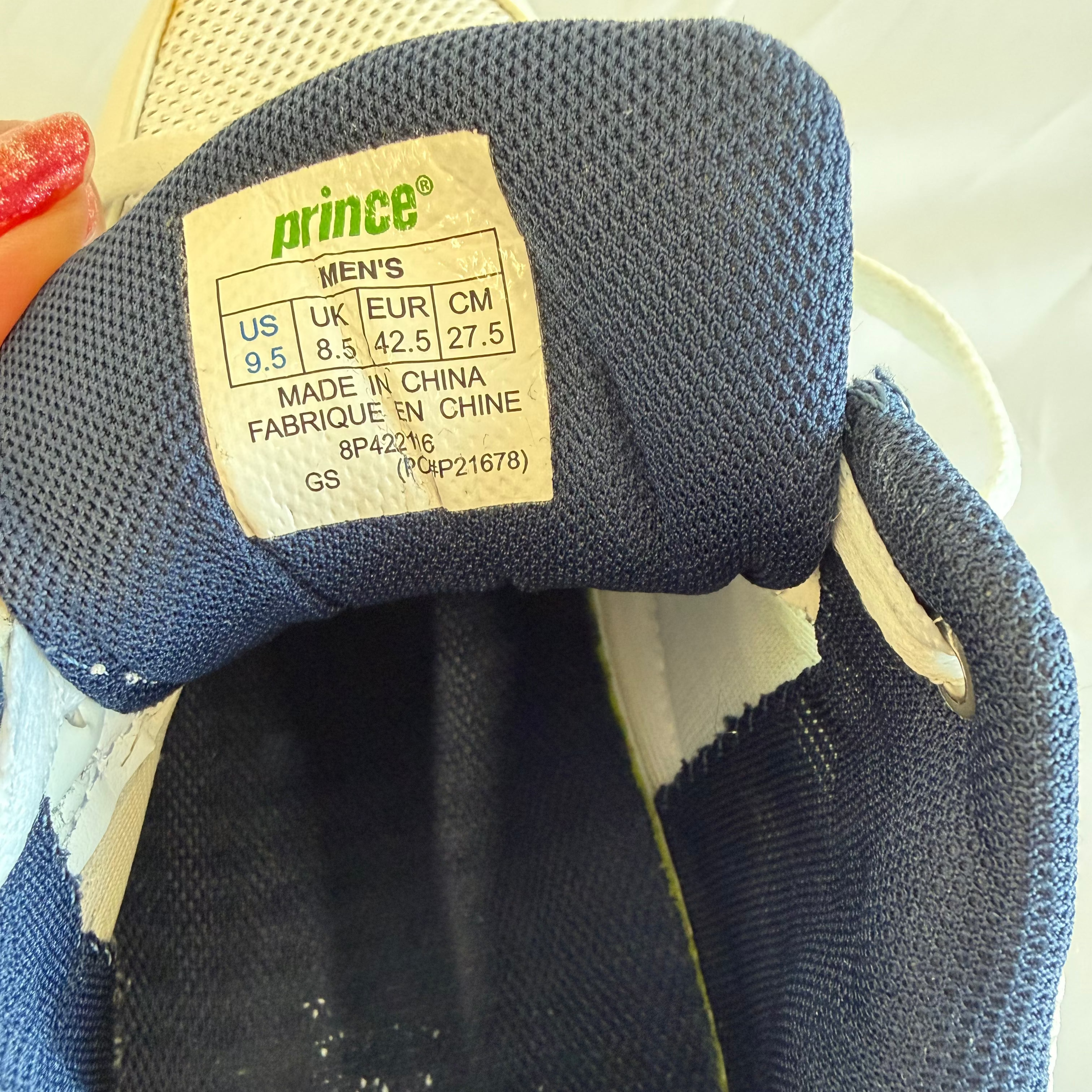 Closeup of inner tongue label on Prince trainers showing sizing details