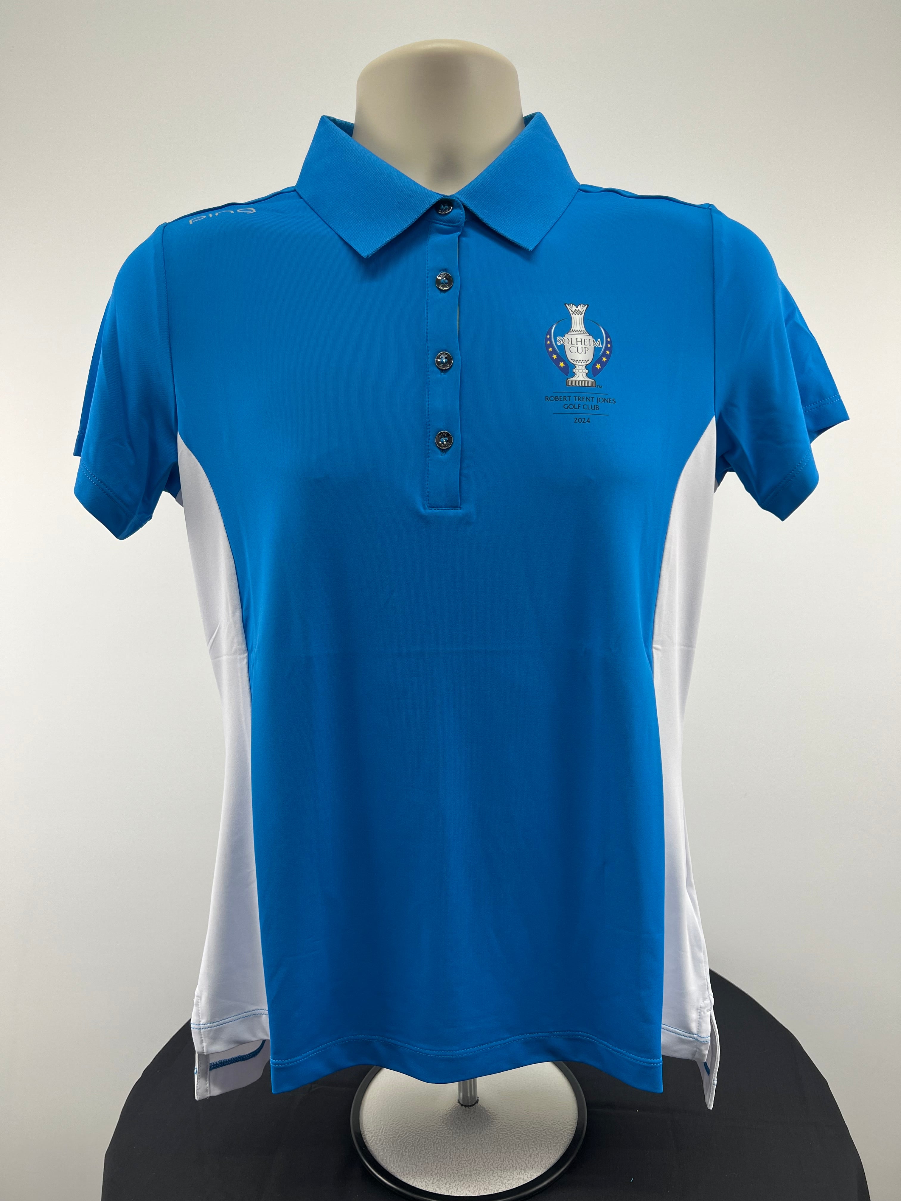 Front view of the Ping Solheim Cup 2024 women's polo shirt on display, highlighting the event logo embroidery
