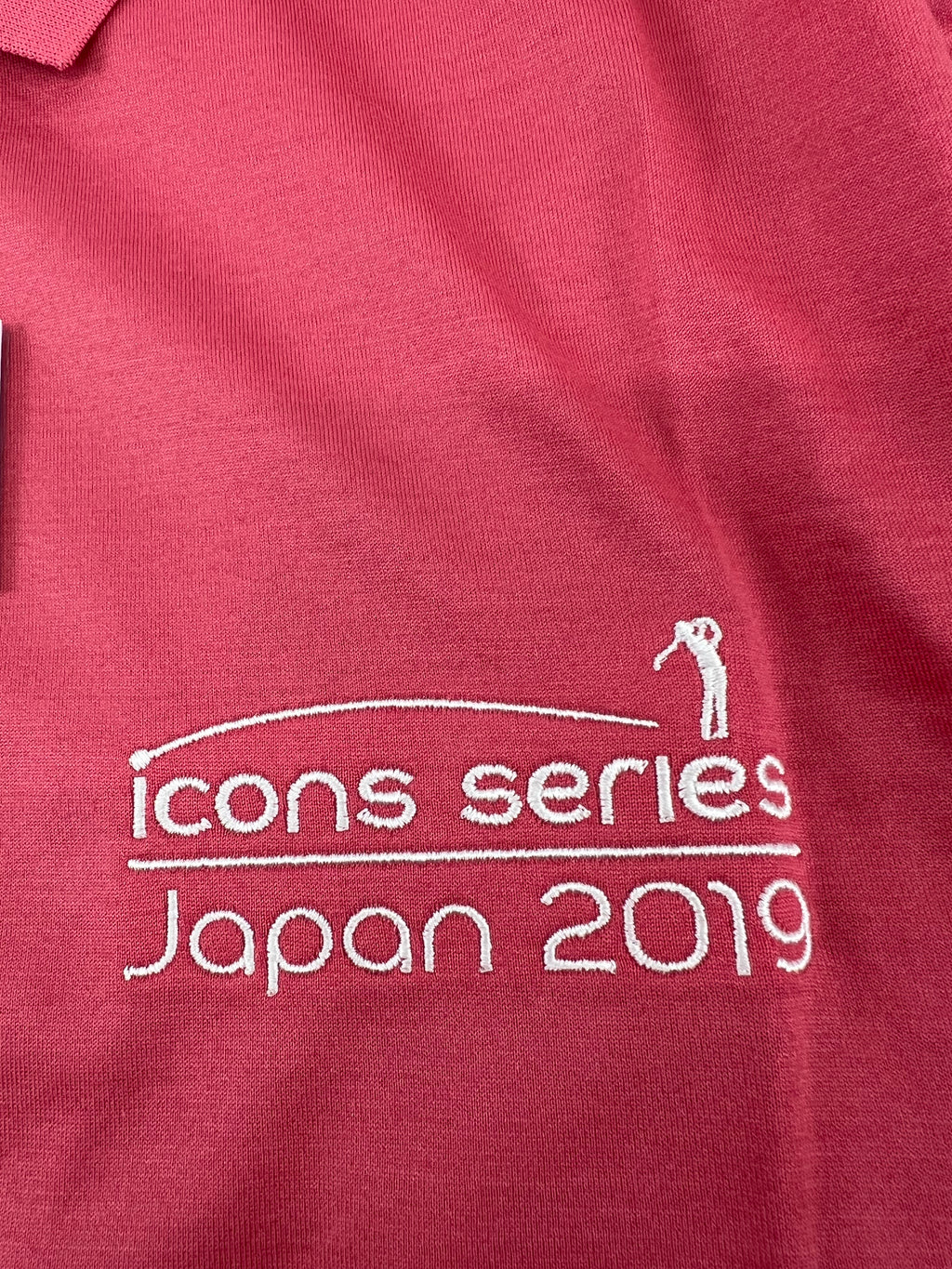Close-up of Japan 2019 Icon Series embroidery on pink Peter Millar polo