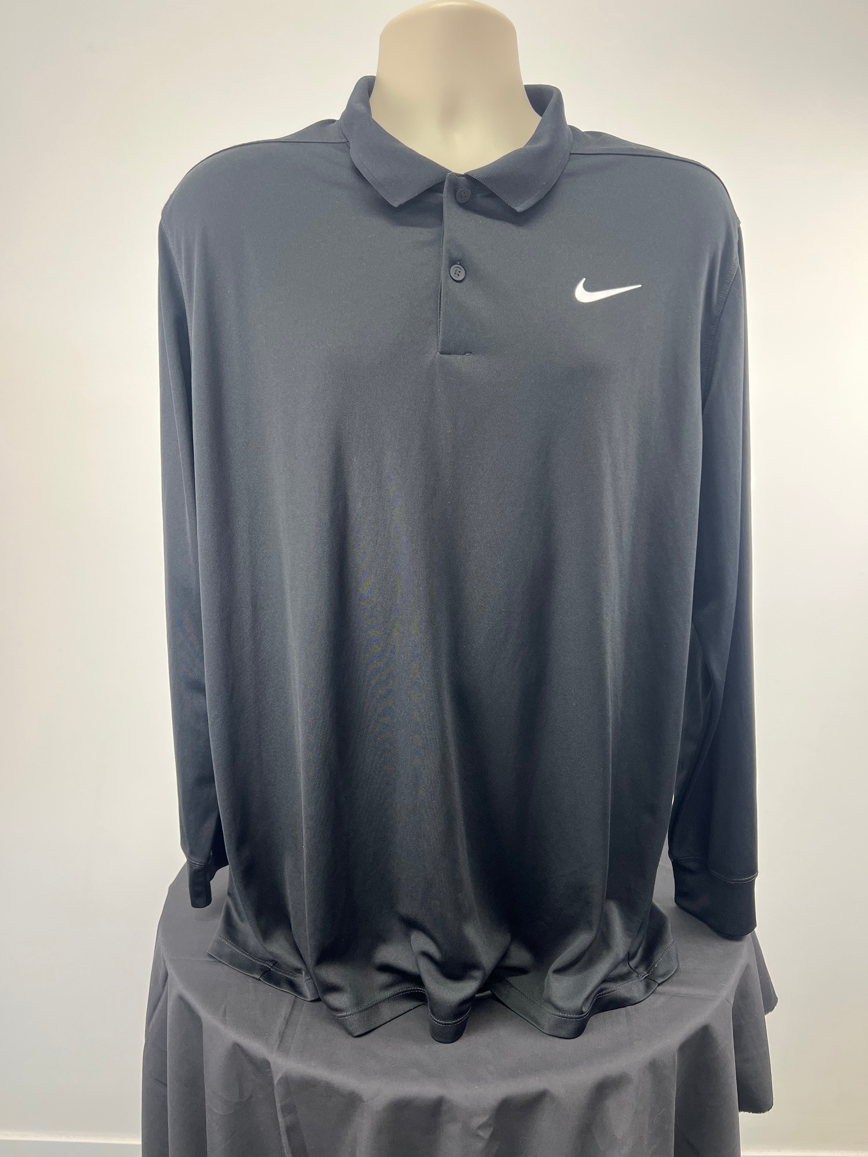 Front view of black Nike men's long sleeve golf polo in size XL